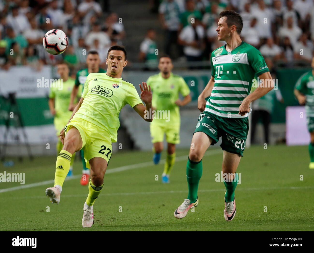 BUDAPEST, HUNGARY - AUGUST 13: (l-r) Tokmac Chol Nguen of Ferencvarosi TC  wins the ball from Arijan Ademi of GNK Dinamo Zagreb during the UEFA  Champions League Third Qualifying Round match between