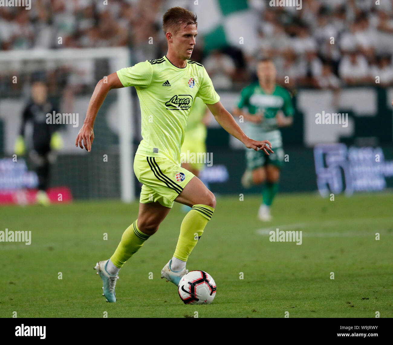 BUDAPEST, HUNGARY - AUGUST 13: (l-r) Tokmac Chol Nguen of Ferencvarosi TC  wins the ball from Arijan Ademi of GNK Dinamo Zagreb during the UEFA  Champions League Third Qualifying Round match between