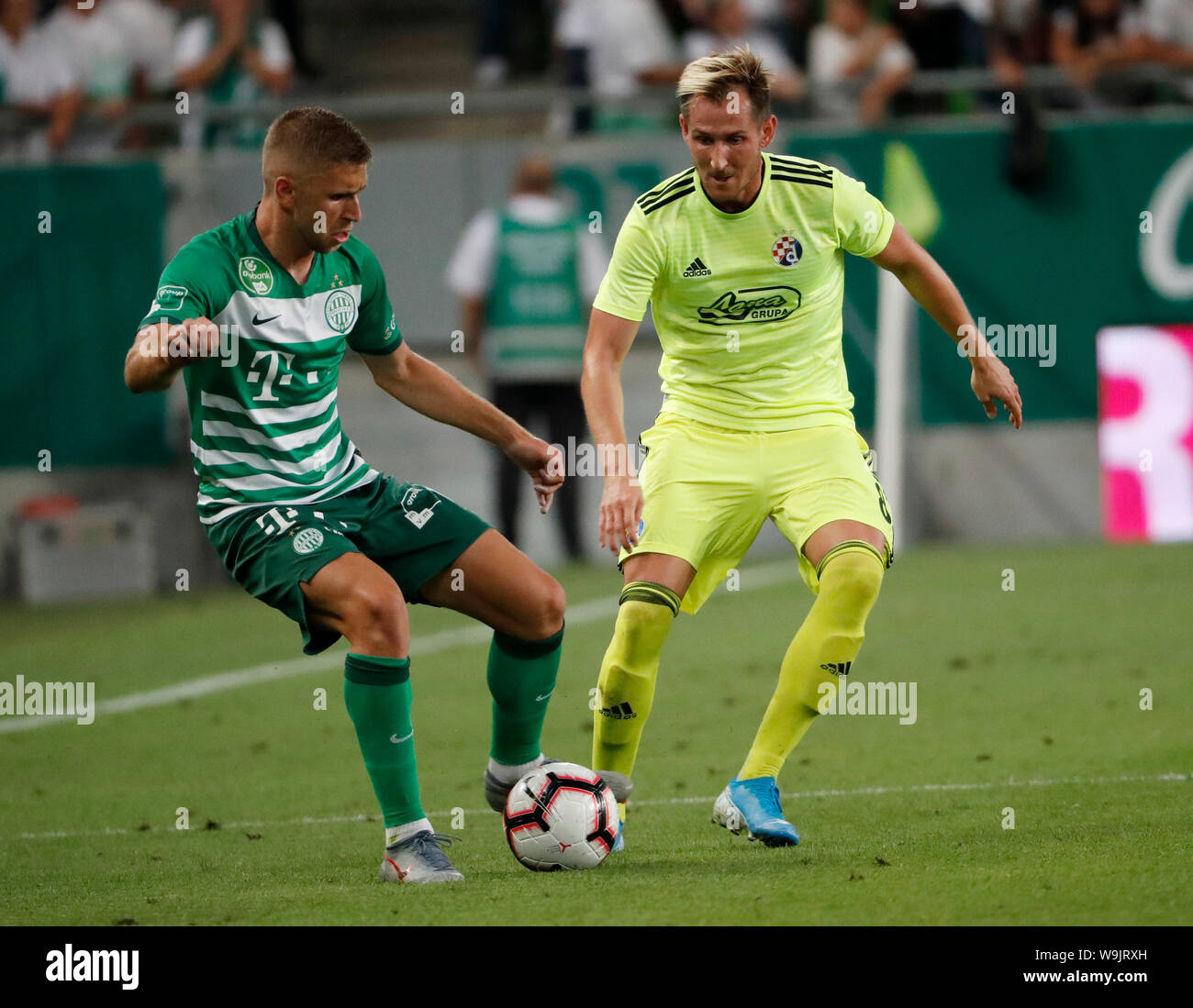 BUDAPEST, HUNGARY - AUGUST 13: (l-r) Eldar Civic of Ferencvarosi TC competes for the ball with Izet Hajrovic of GNK Dinamo Zagreb during the UEFA Champions League Third Qualifying Round match between Ferencvarosi TC and GNK Dinamo Zagreb at Ferencvaros Stadium on August 13, 2019 in Budapest, Hungary. Stock Photo