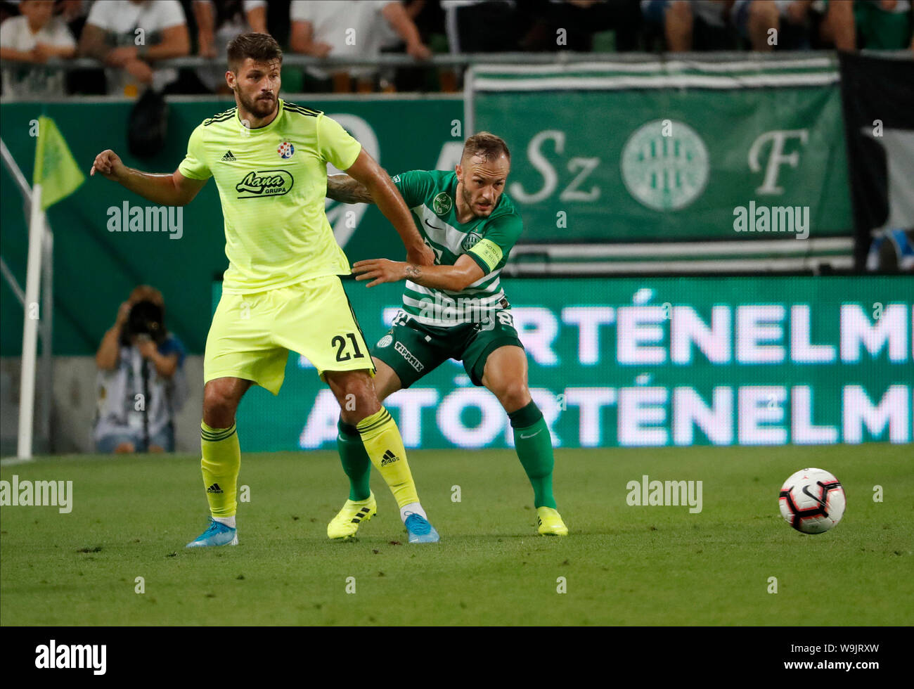 BUDAPEST, HUNGARY - AUGUST 13: (l-r) Tokmac Chol Nguen of Ferencvarosi TC  wins the ball from Arijan Ademi of GNK Dinamo Zagreb during the UEFA  Champions League Third Qualifying Round match between