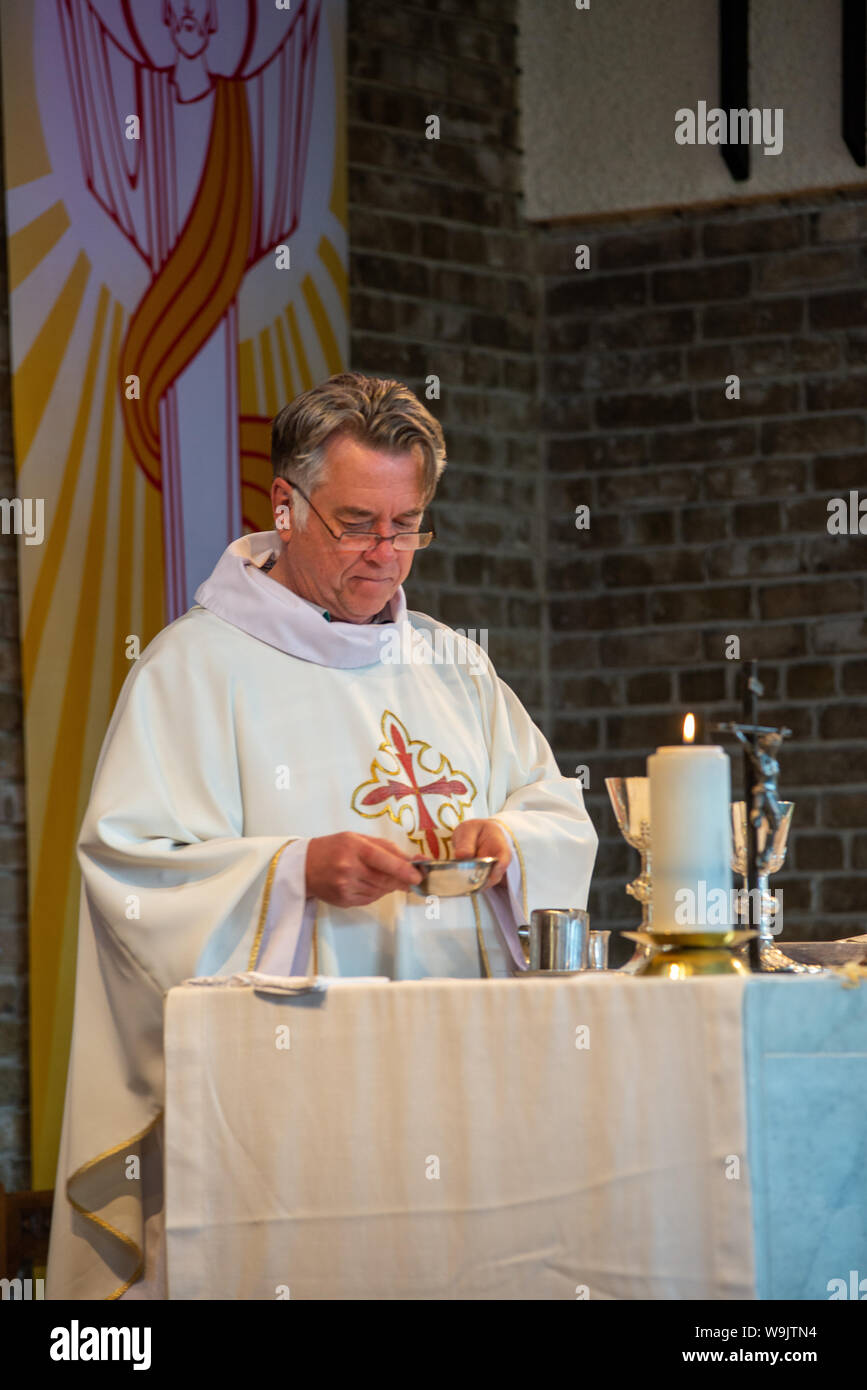 catholic priest perfoming mass Stock Photo