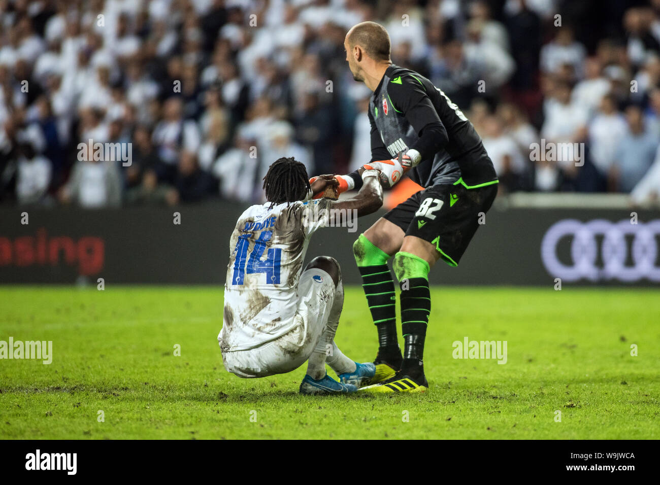 Copenhagen, Denmark. 13th Aug, 2019. Milan Borjan (82) of Red Star Belgrade gives a hand to Dame N'Doye (14) of FC Copenhagen during the Champions League qualification match between FC Copenhagen and Red Star Belgrade at Telia Parken. (Photo Credit: Gonzales Photo/Alamy Live News Stock Photo