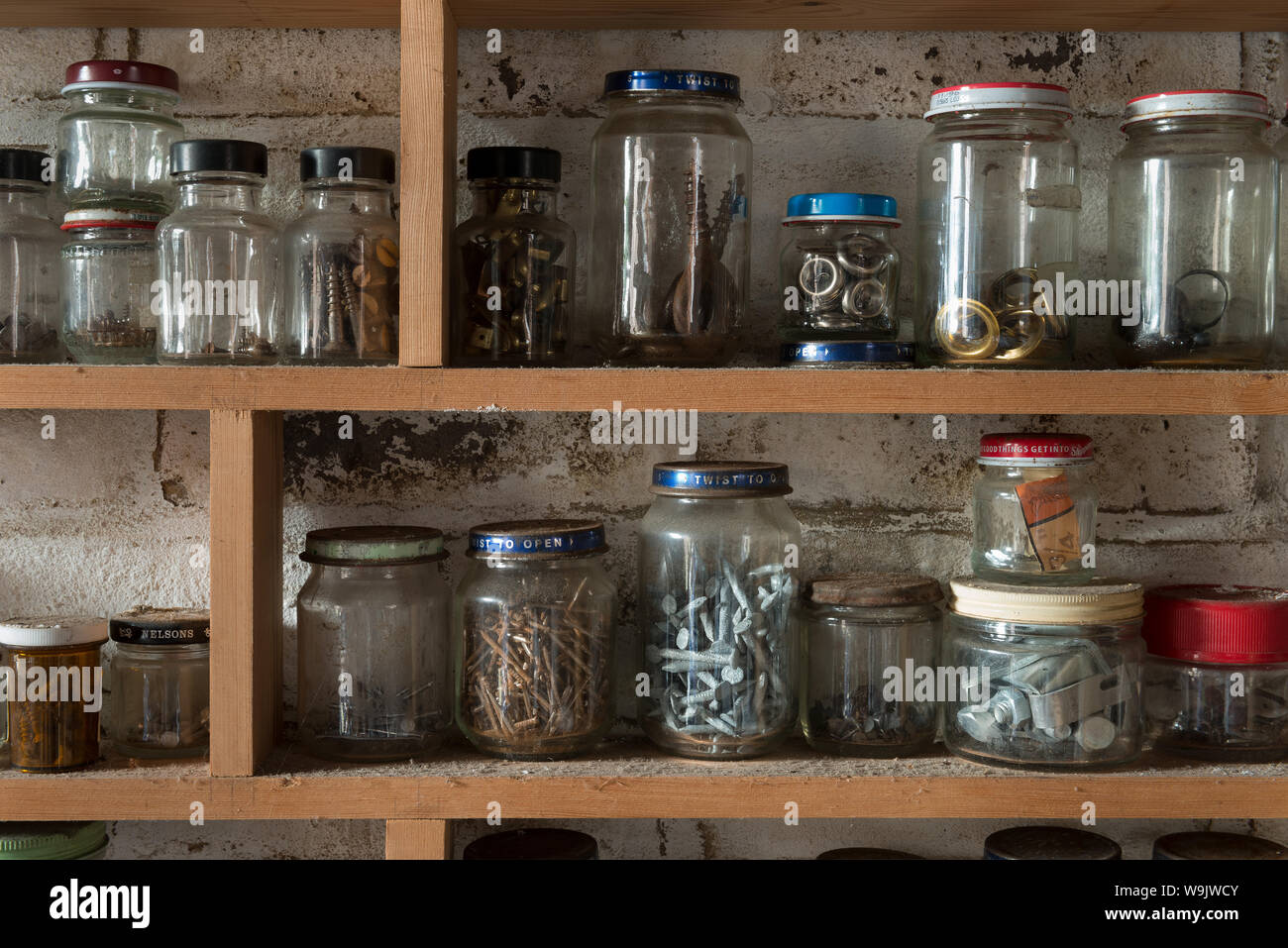 Rows of recycled glass jars containers used to store different sized