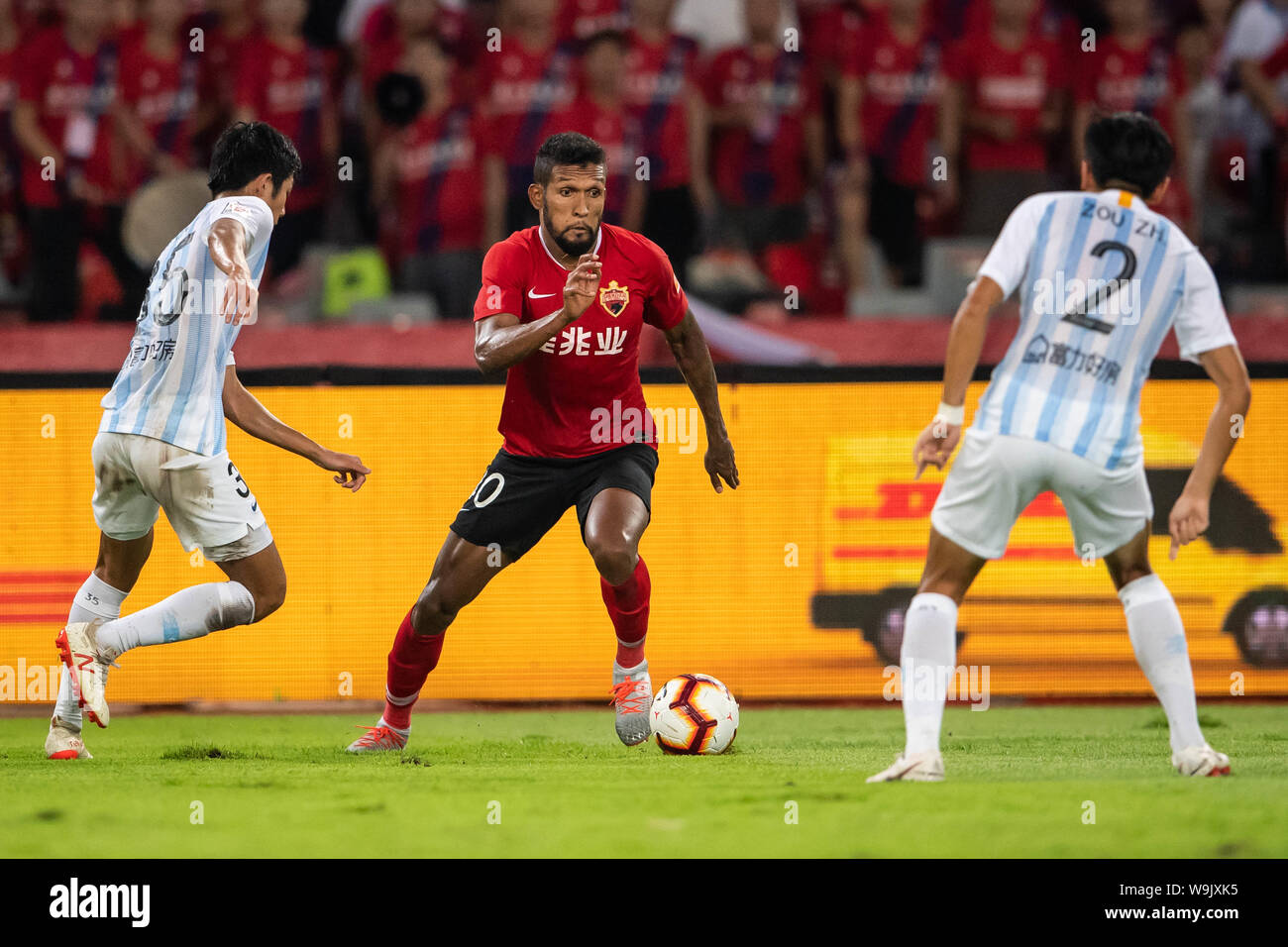 Brazilian-born Portuguese football player Dyego Sousa of Shenzhen F.C., middle, chases after the ball in the 22nd round match during the 2019 Chinese Football Association Super League (CSL) in Shenzhen city, Guandong province, China, 14 August 2019. Stock Photo