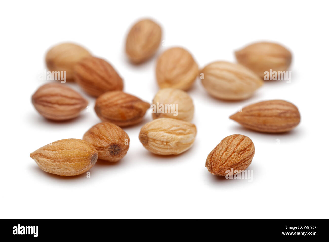 Heap of mahlep or mahaleb seeds isolated on white background Stock Photo