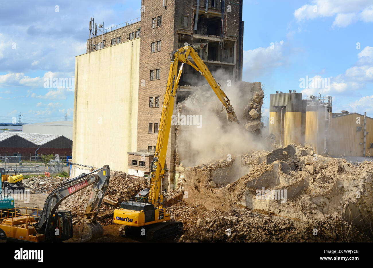 high reach demolition arm demolishing industrial concrete structure eggborough yorkshire united kingdom Stock Photo