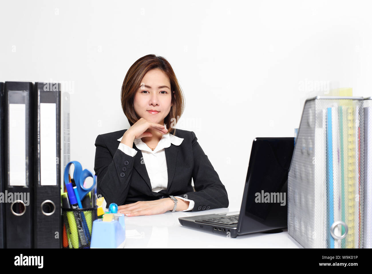 The smart Asian business woman working in office on the table Stock Photo