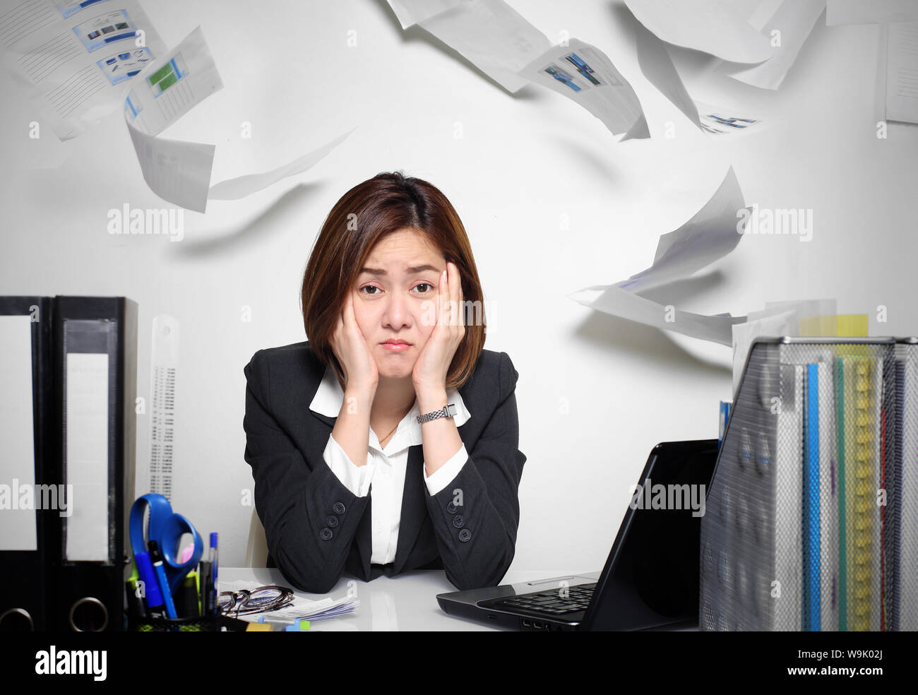 The businesswoman asian serious and busy with trouble her working Stock Photo