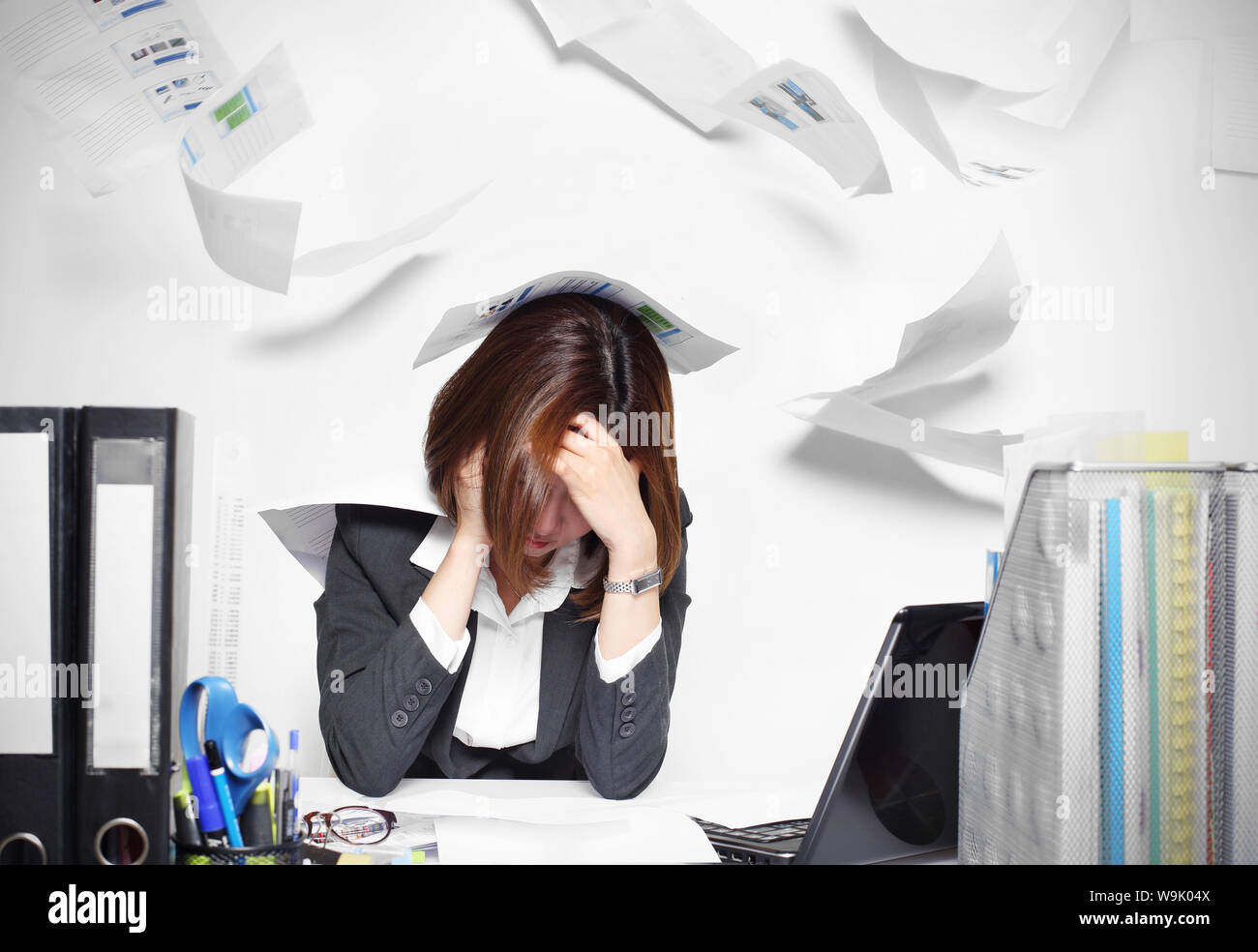 The businesswoman asian serious and busy with trouble her working Stock Photo