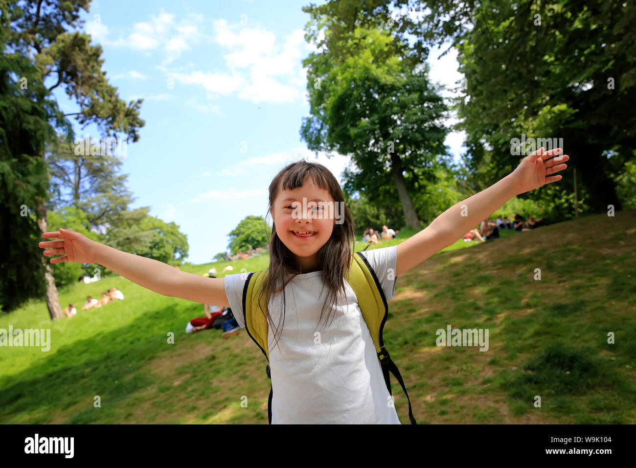 Portrait of little girl smiling outside Stock Photo - Alamy