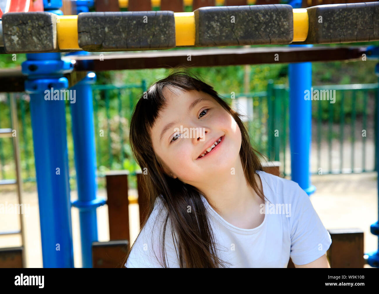 Portrait of little girl smiling in the park Stock Photo - Alamy