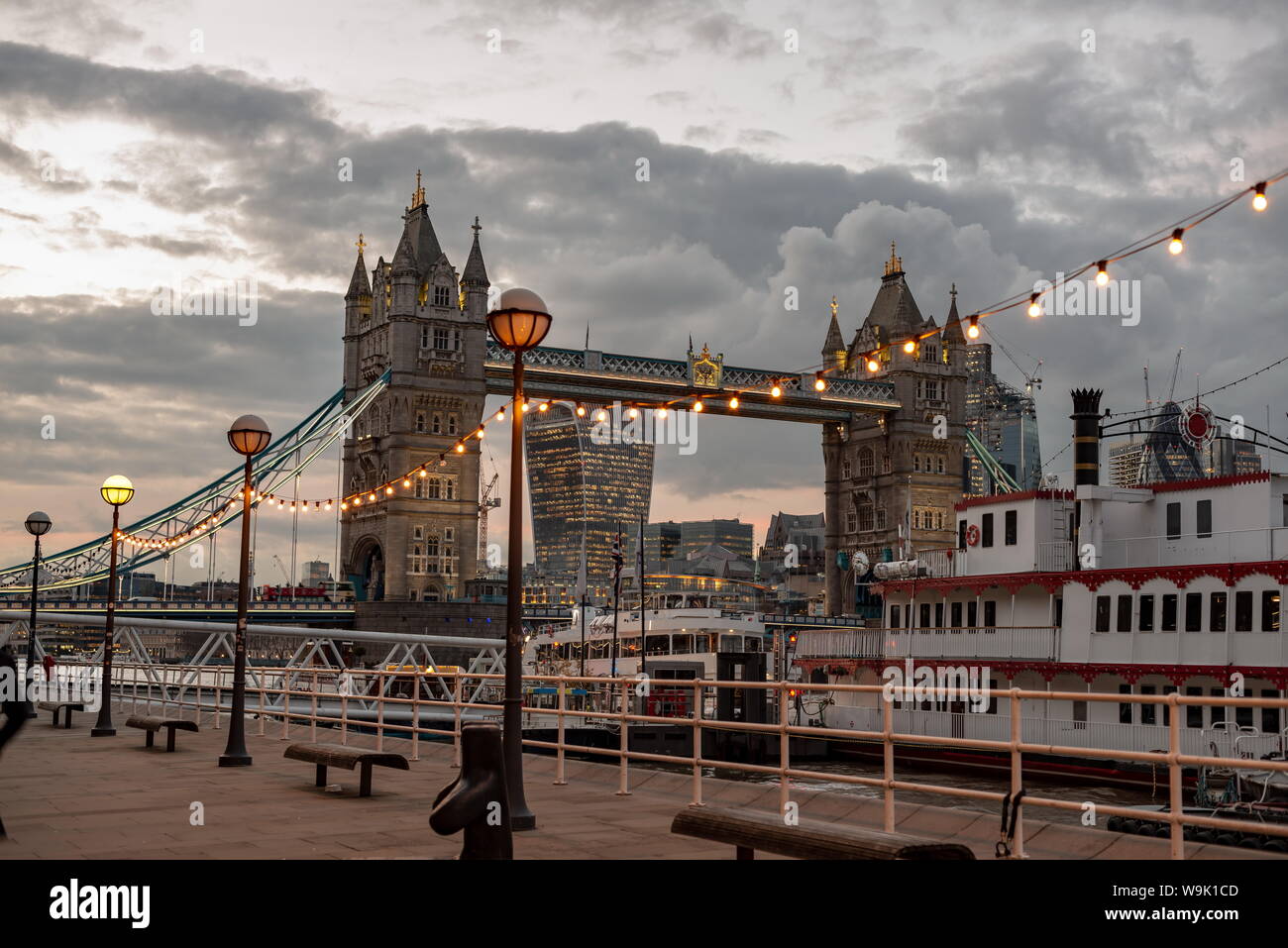 Tower Bridge in London, the UK. Sunset with beautiful clouds. Drawbridge opening. One of English symbols Stock Photo