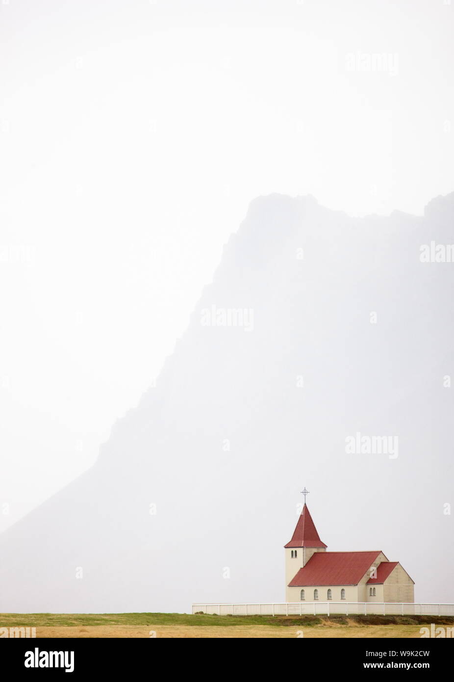Isolated church with hazy outline of distant mountain in the background, Snaefellsnes Peninsula, Iceland, Polar Regions Stock Photo