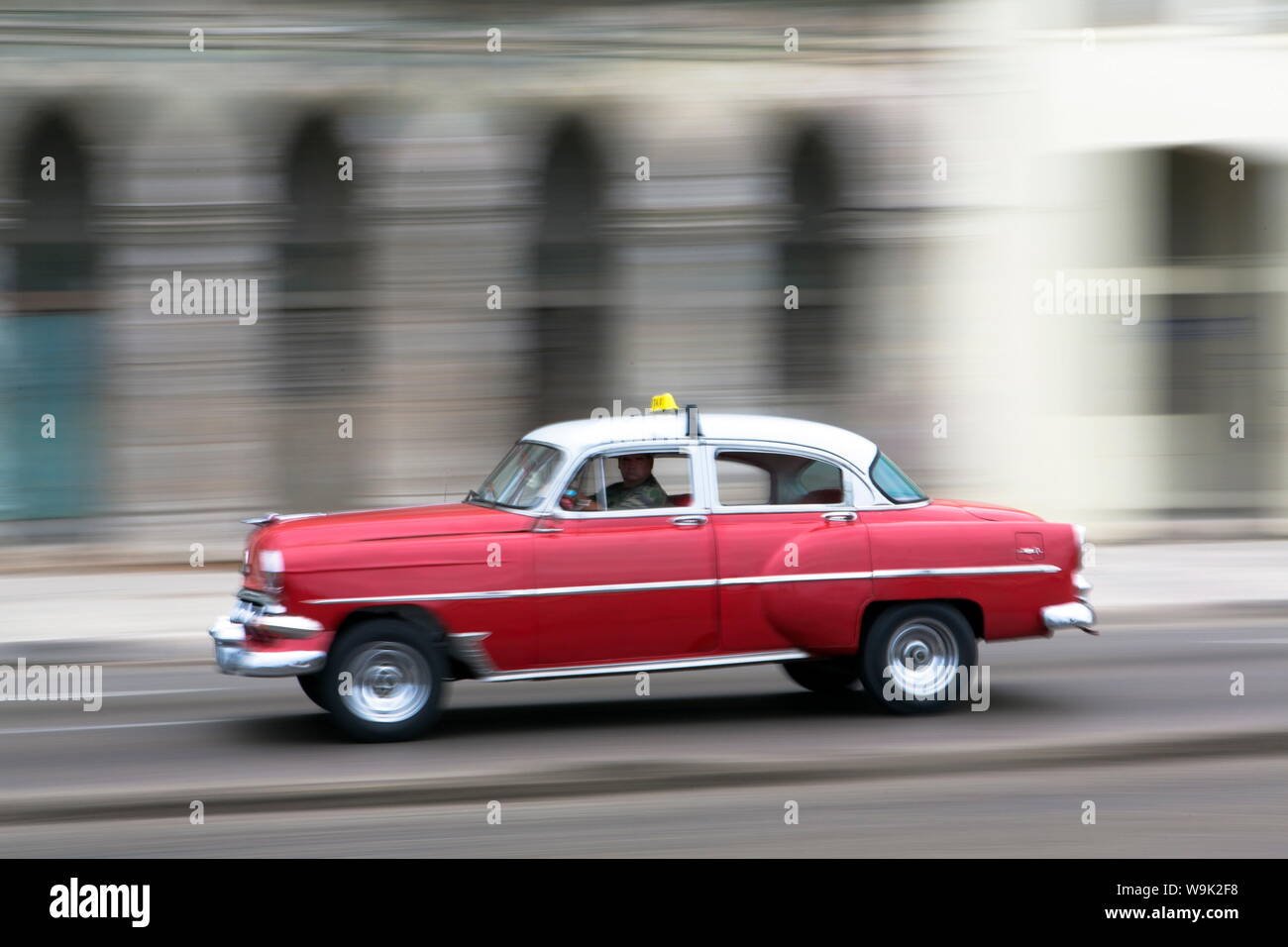 Panned shot of vintage American car on The Malecon, Havana, Cuba, West Indies, Caribbean, Central America Stock Photo
