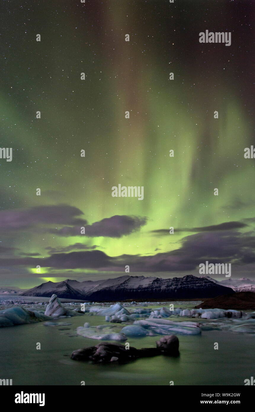 The Aurora Borealis (Northern Lights) captured in the night sky over Jokulsarlon glacial lagoon on the edge of the Vatnajokull National Park, Iceland Stock Photo