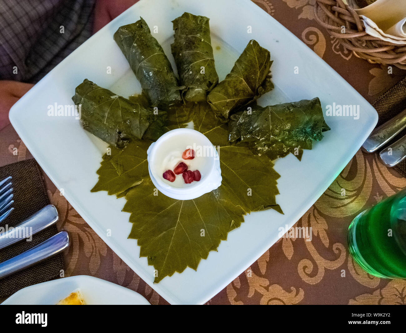 Delicious dolma sarma stuffed grape leaves rice, white yogurt sauce