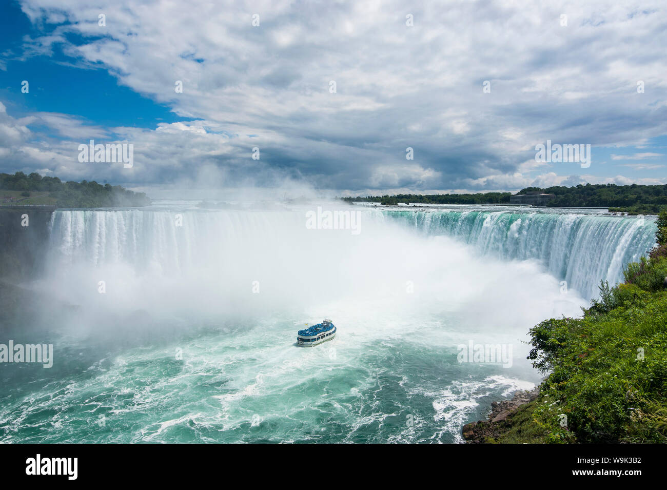 Tourist boat in the mist of the Horseshoe Falls (Canadian Falls), Niagara Falls, Ontario, Canada, North America Stock Photo