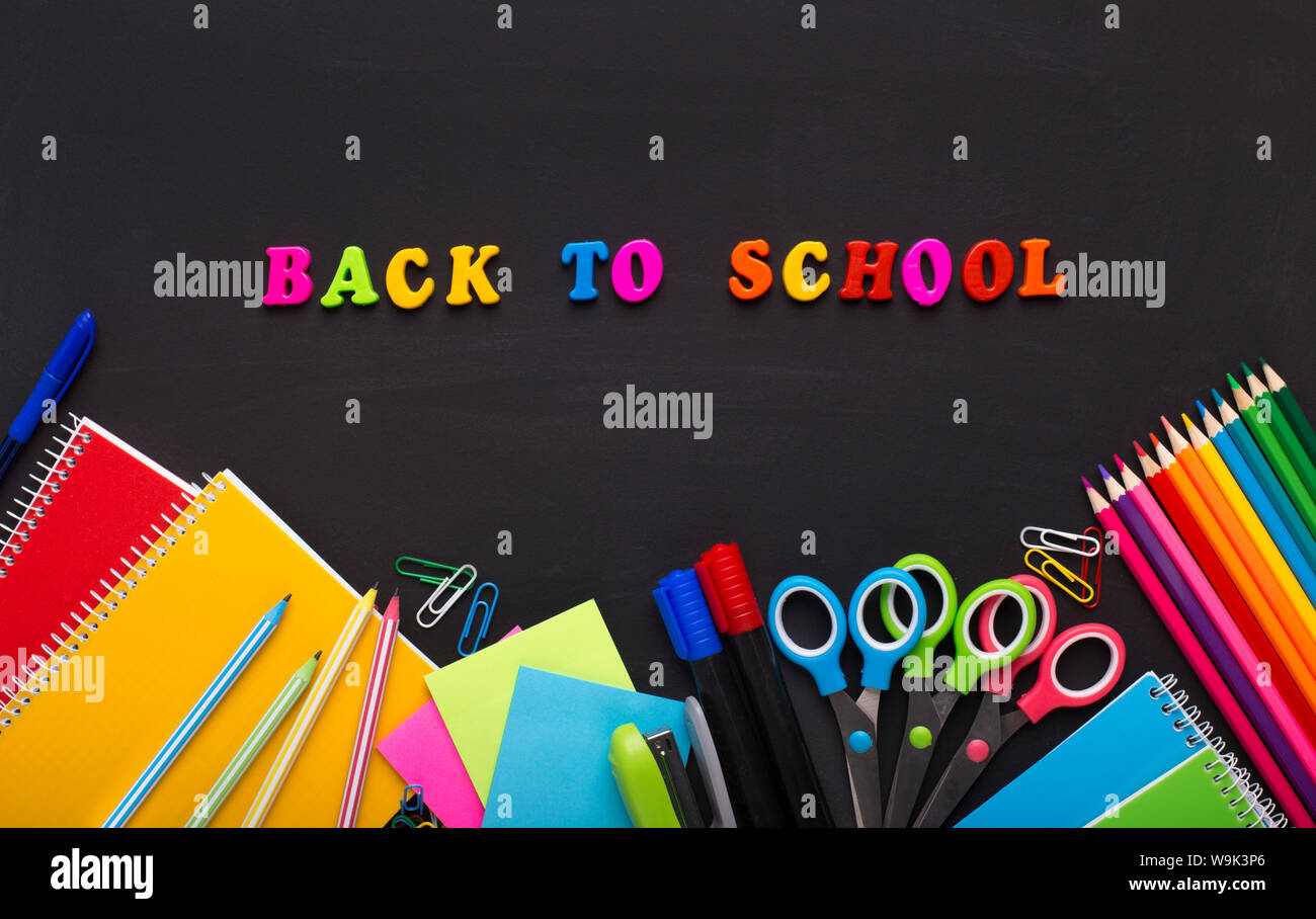 Colored Back to school text with stationery on chalk board Stock Photo ...