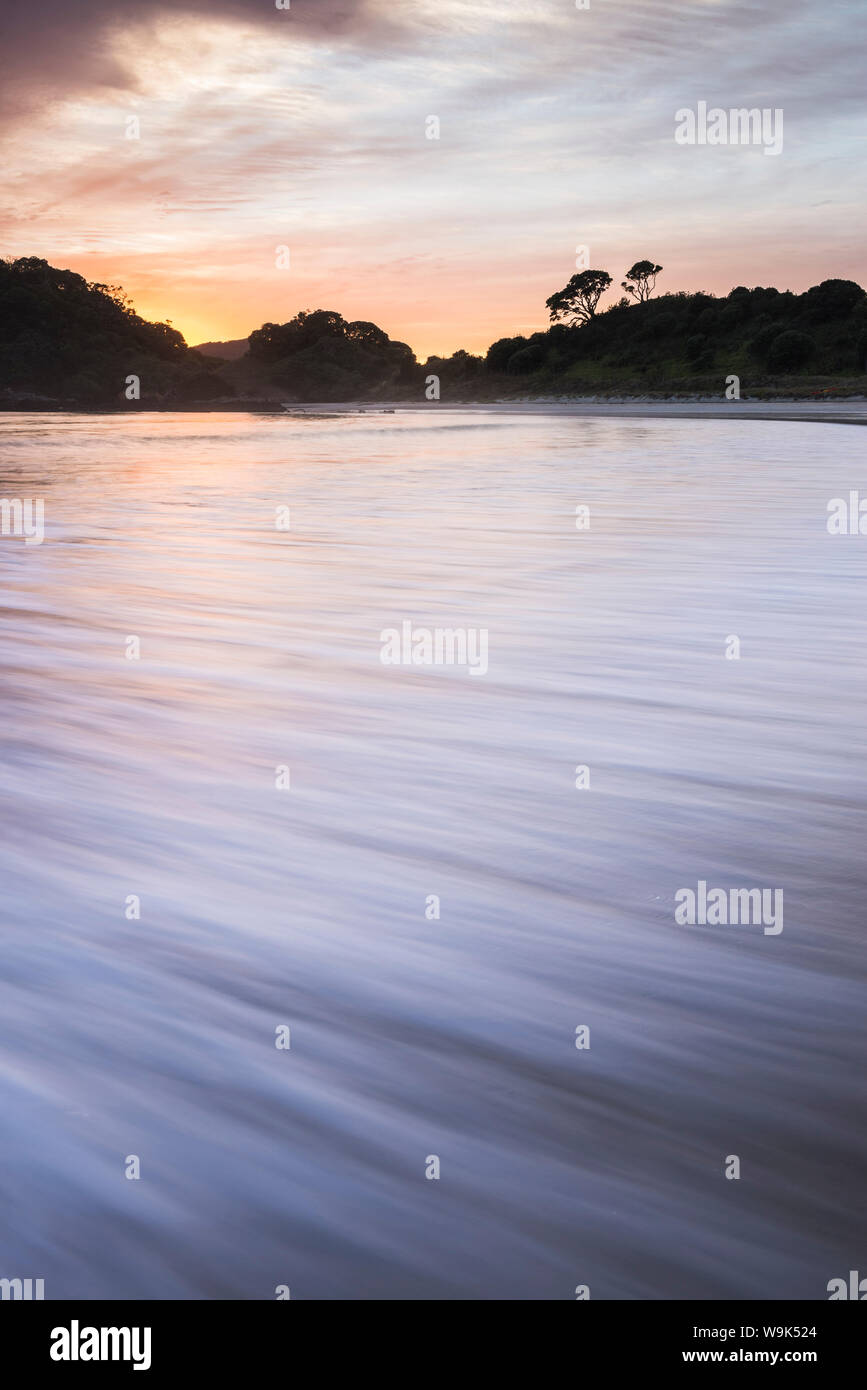 Sunrise at Maitai Bay (Matai Bay), a popular beach on the Karikari Peninsula, Northland, New Zealand, Pacific Stock Photo