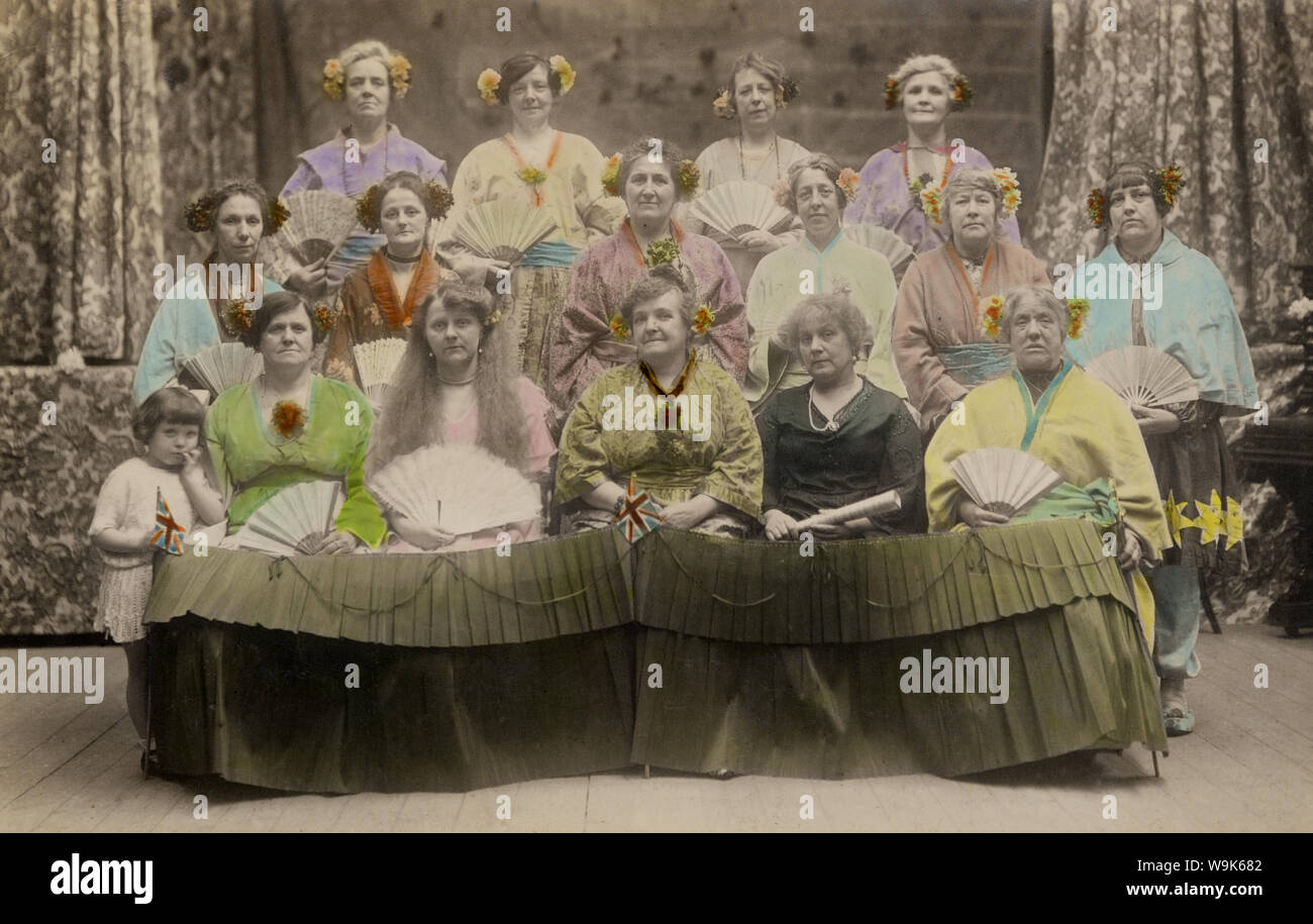 [ 1900s - Westerners in Fake Japanese Kimono ] —   Western women dressed in faux Japanese clothes. During the late 1800s and early 1900s, it was very popular for Westerners to have themselves photographed in Japanese clothing and settings.  20th century vintage postcard. Stock Photo