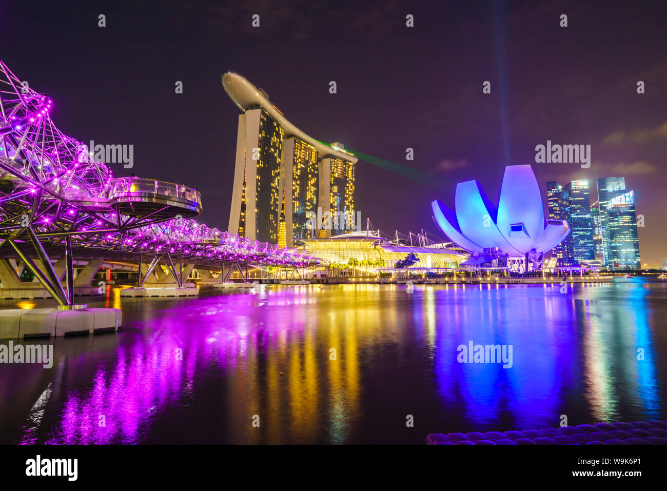 Helix Bridge, Marina Bay Sands and ArtScience Museum illuminated at night, Marina Bay, Singapore, Southeast Asia, Asia Stock Photo