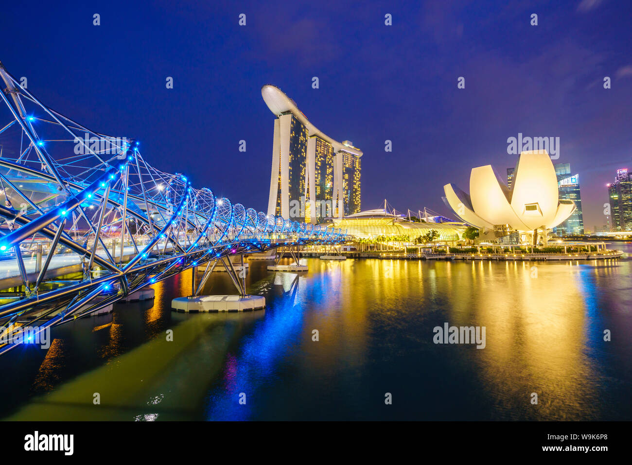 Helix Bridge, Marina Bay Sands and ArtScience Museum illuminated at night, Marina Bay, Singapore, Southeast Asia, Asia Stock Photo
