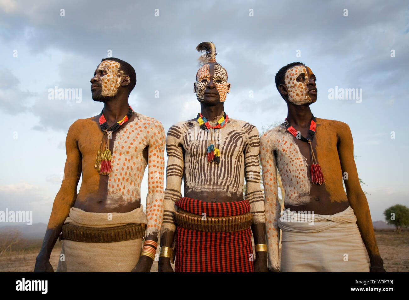 Karo tribesmen with face and body painting imitating the spotted plumage of the guinea fowl, Omo river, Lower Omo Valley, Ethiopia, Africa Stock Photo