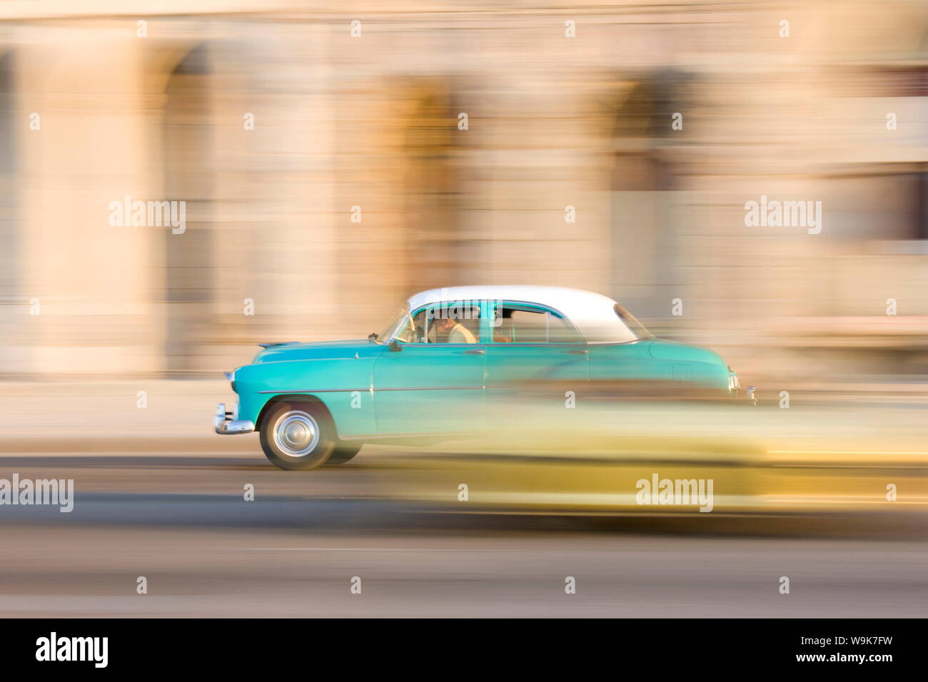 Panned shot of a classic American car on The Malecon, Havana, Cuba, West Indies, Central America Stock Photo