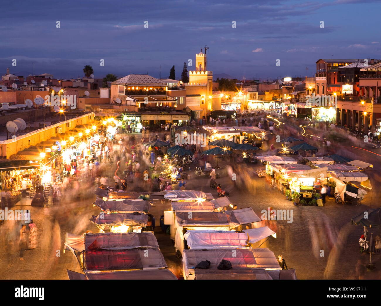 View over Djemaa el Fna at dusk with foodstalls and crowds of people, Marrakech, Morocco, North Africa, Africa Stock Photo