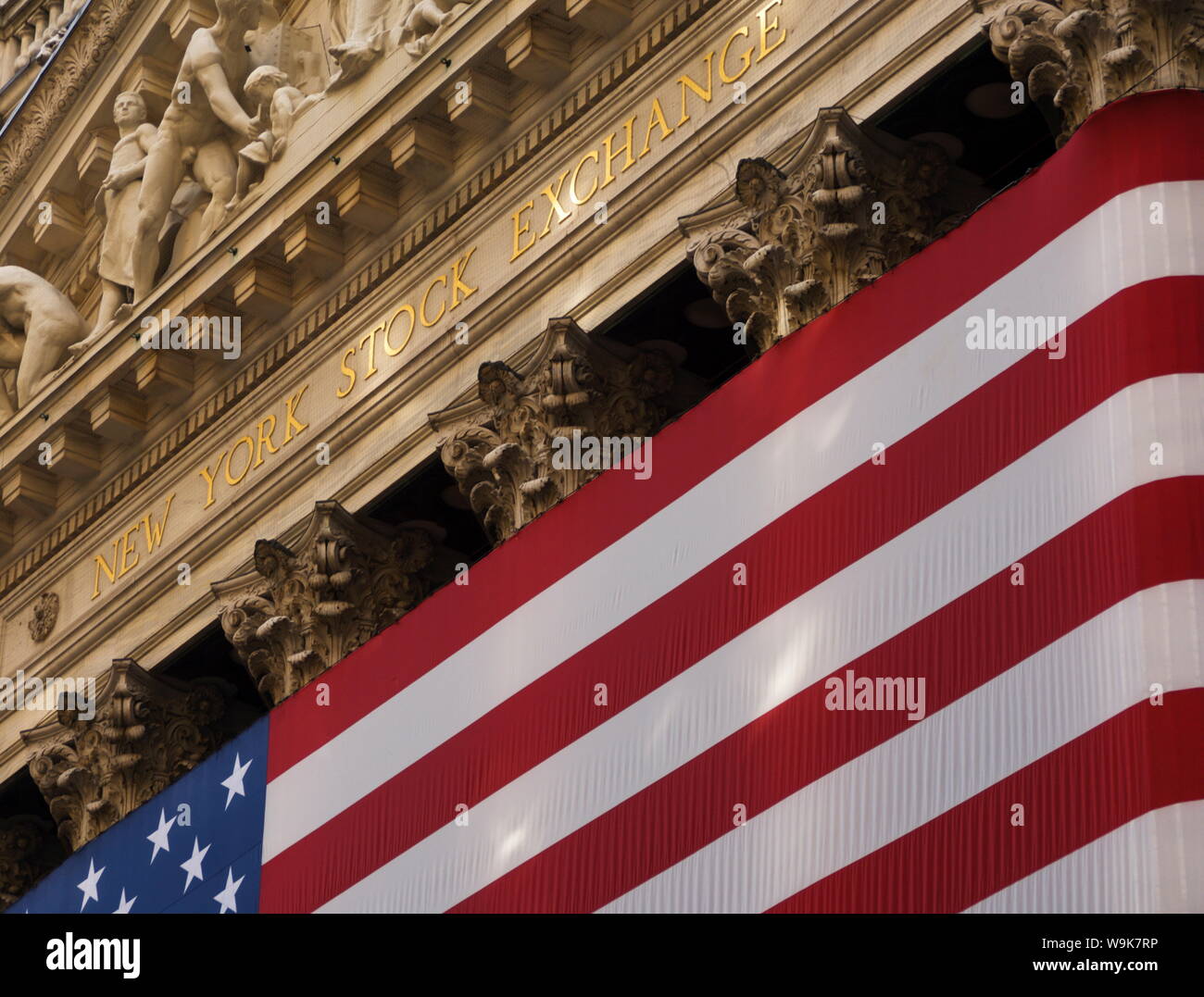 New York Stock Exchange and American flag, Wall Street, Financial District, New York City, New York, United States of America, North America Stock Photo