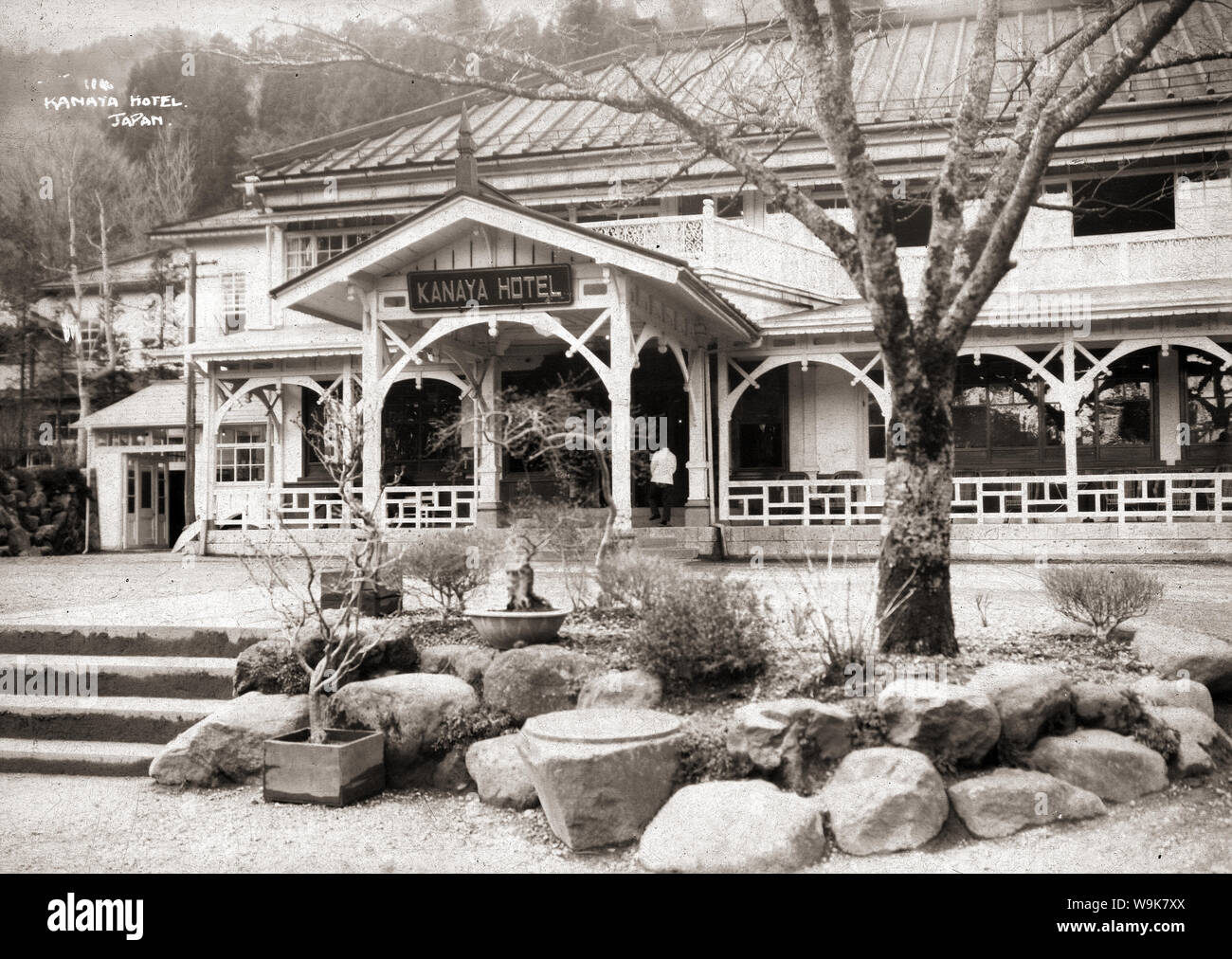 [ 1920s Japan - TITLE ] —   The Nikko Kanaya Hotel (日光金谷ホテル) in Nikko, Tochigi Prefecture. The hotel was founded by Zenichiro Kanaya (金谷善一郎 ) as the 'Cottage Inn' in 1873 (Meiji 6).   In 1892 (Meiji 26), Kanaya bought  the Mikado Hotel when it was still under construction. The following year he moved his hotel to the new location, pictured in this photo, and named it the Nikko Kanaya Hotel. The hotel had two floors and thirty rooms. Together with the Nikko Hotel, with which it competed fiercely, it was Nikko’s top Western style hotel.  20th century vintage glass negative. Stock Photo