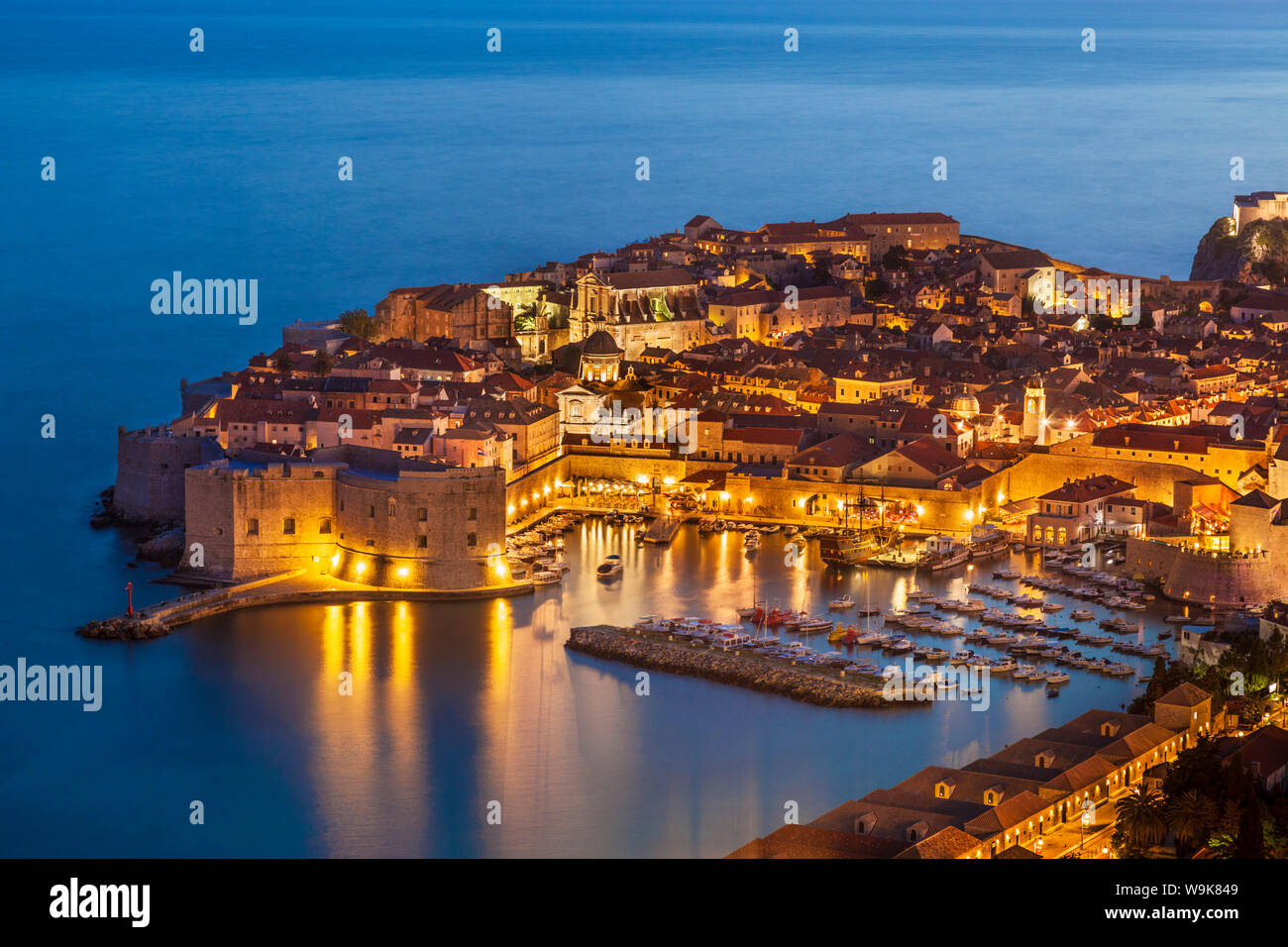 Aerial view of Old Port and Dubrovnik Old Town at night, UNESCO World Heritage Site, Dubrovnik, Dalmatian Coast, Croatia, Europe Stock Photo