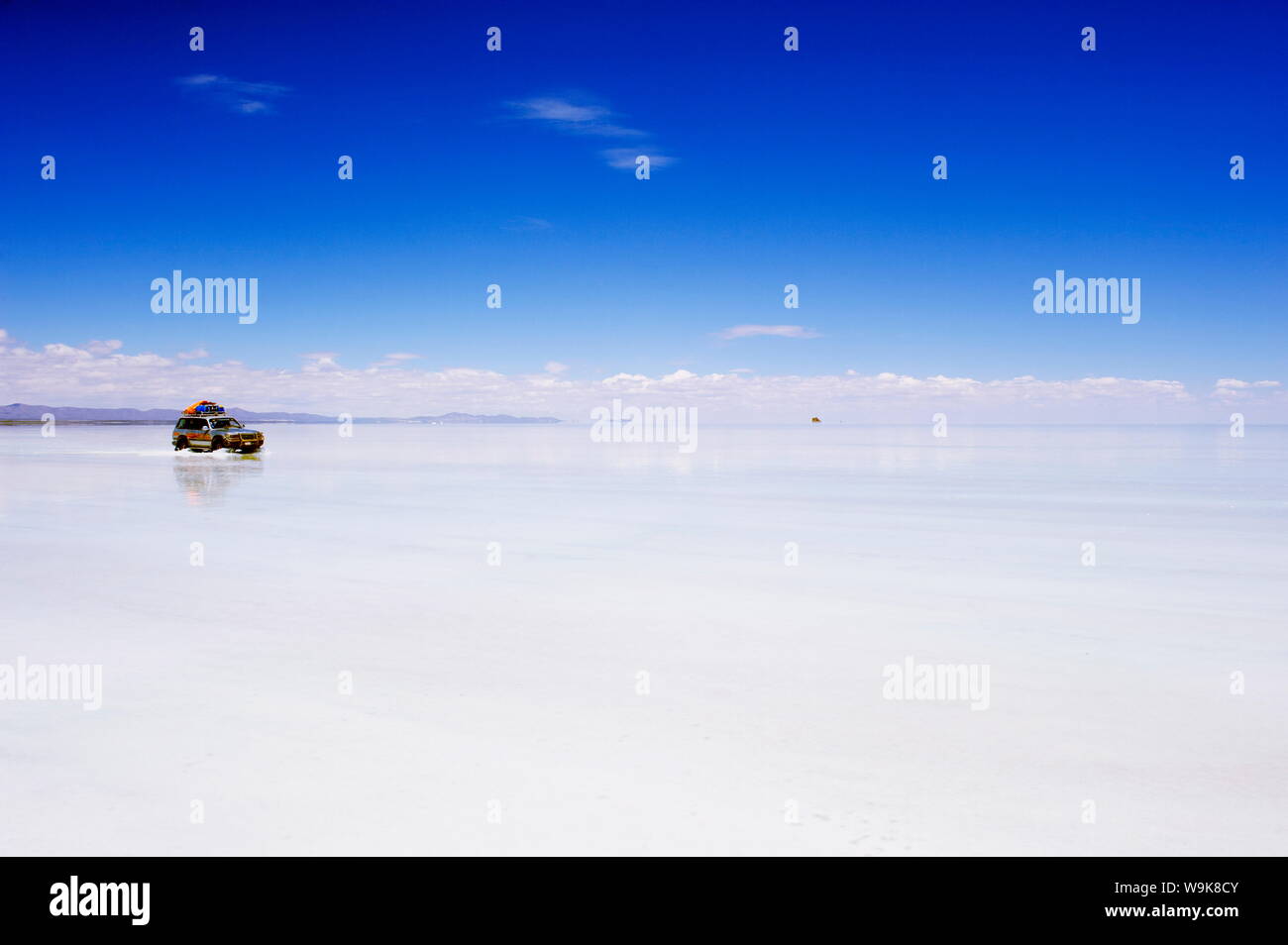 Four wheel drive (4WD) tour group on Salir de Uyuni, salt flats, Bolivia, South America Stock Photo