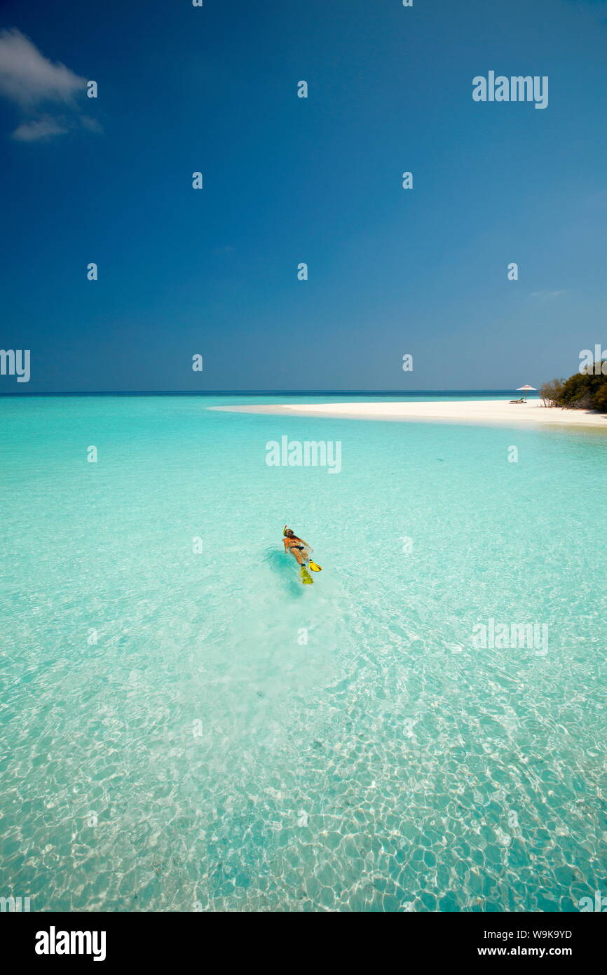 Young woman snorkelling in the Maldives, Indian Ocean, Asia Stock Photo