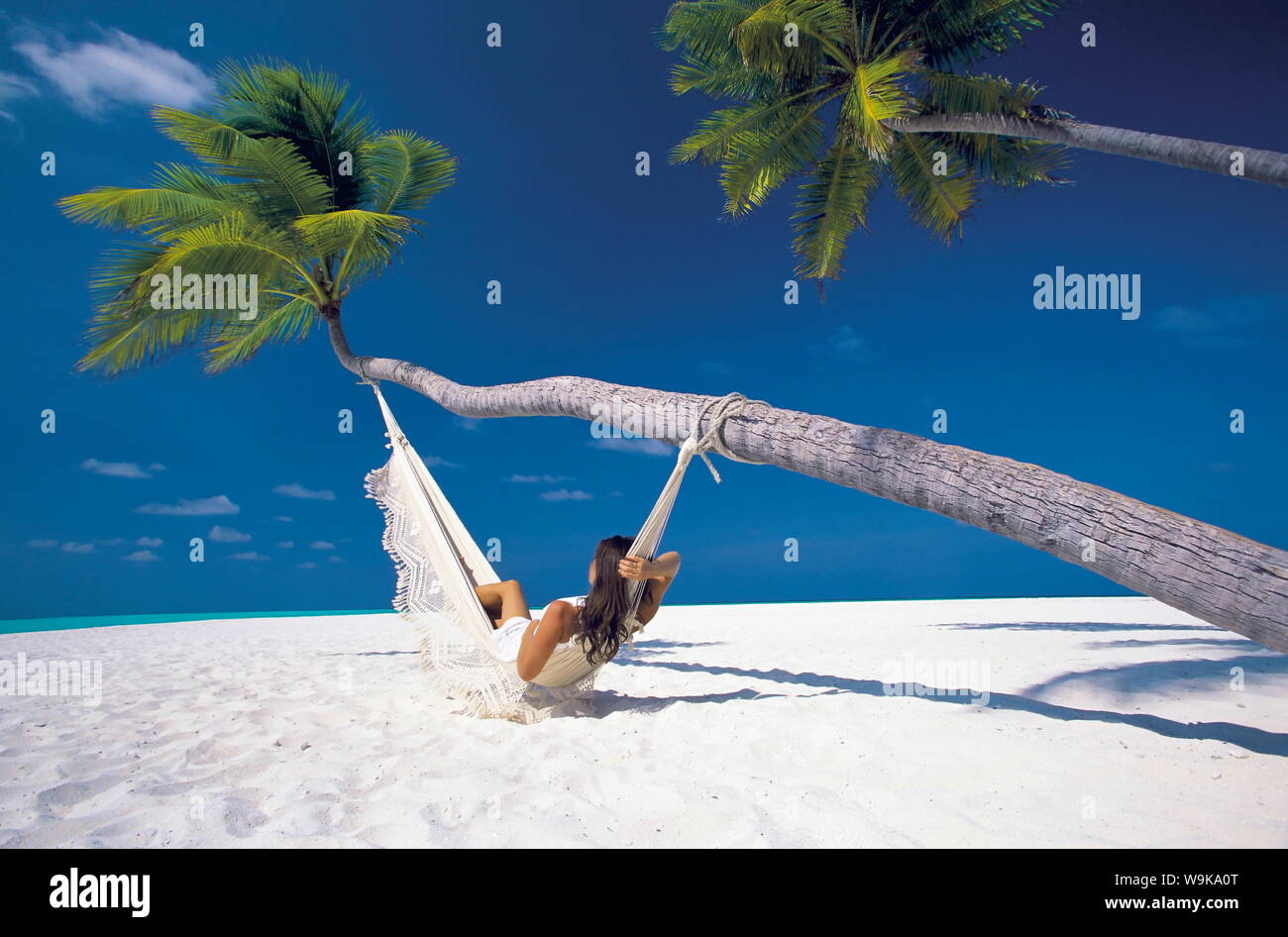 Woman in hammock on beach, Maldives, Indian Ocean, Asia Stock Photo - Alamy