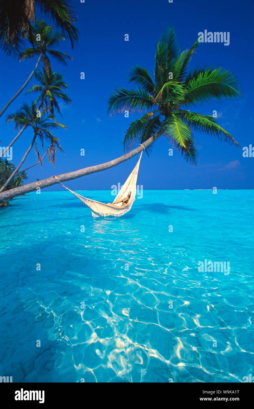 Woman in hammock, Maldives, Indian Ocean, Asia Stock Photo