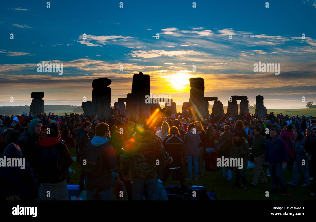 Sunrise at Summer Solstice celebrations, Stonehenge, UNESCO World Heritage Site, Wiltshire, England, United Kingdom, Europe Stock Photo