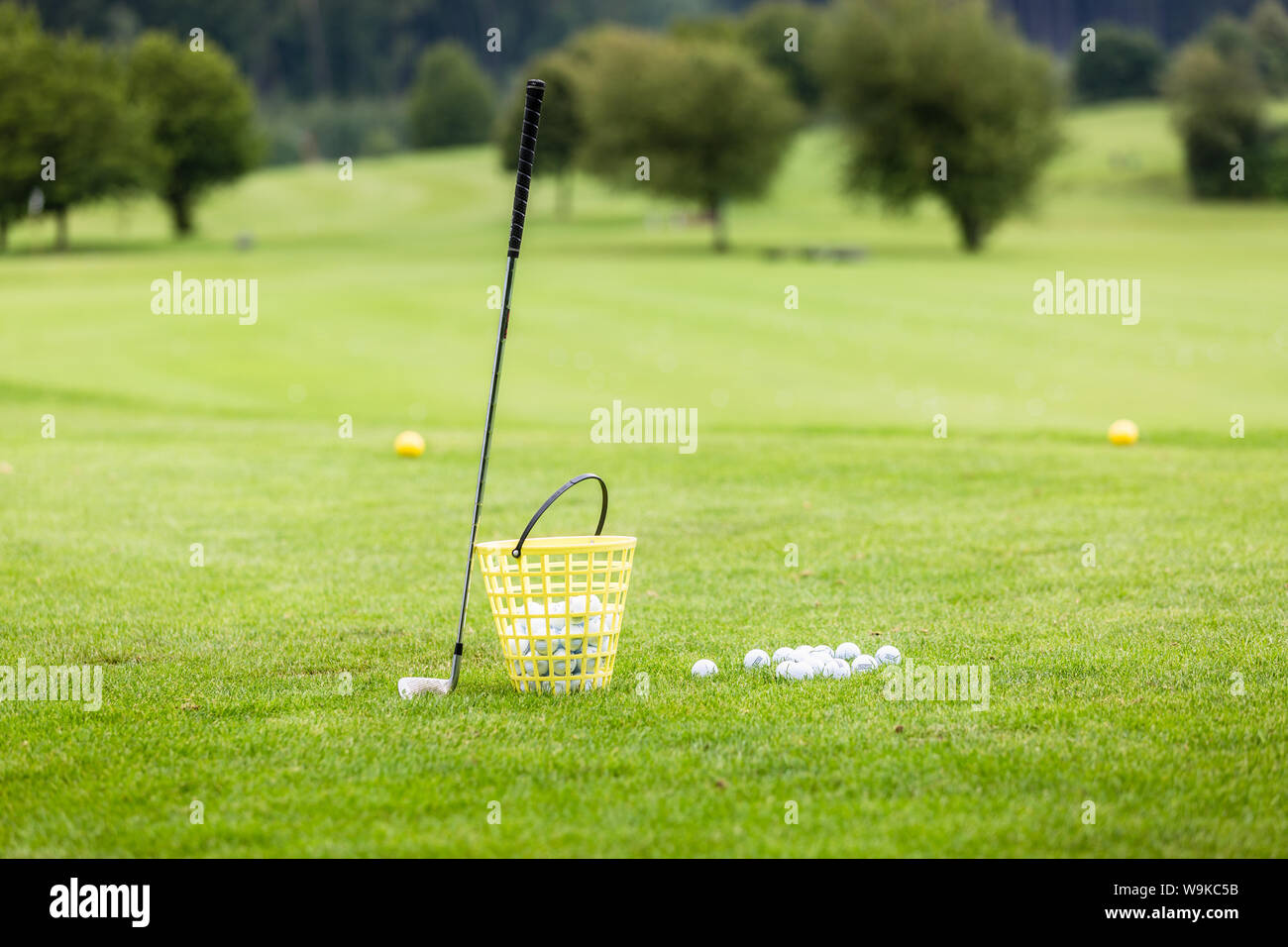 Golf course with club and balls Stock Photo Alamy