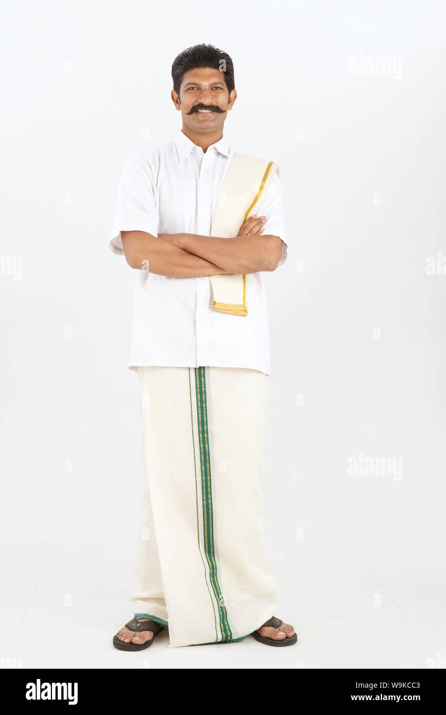 South indian man standing arms hi-res stock photography and images - Alamy