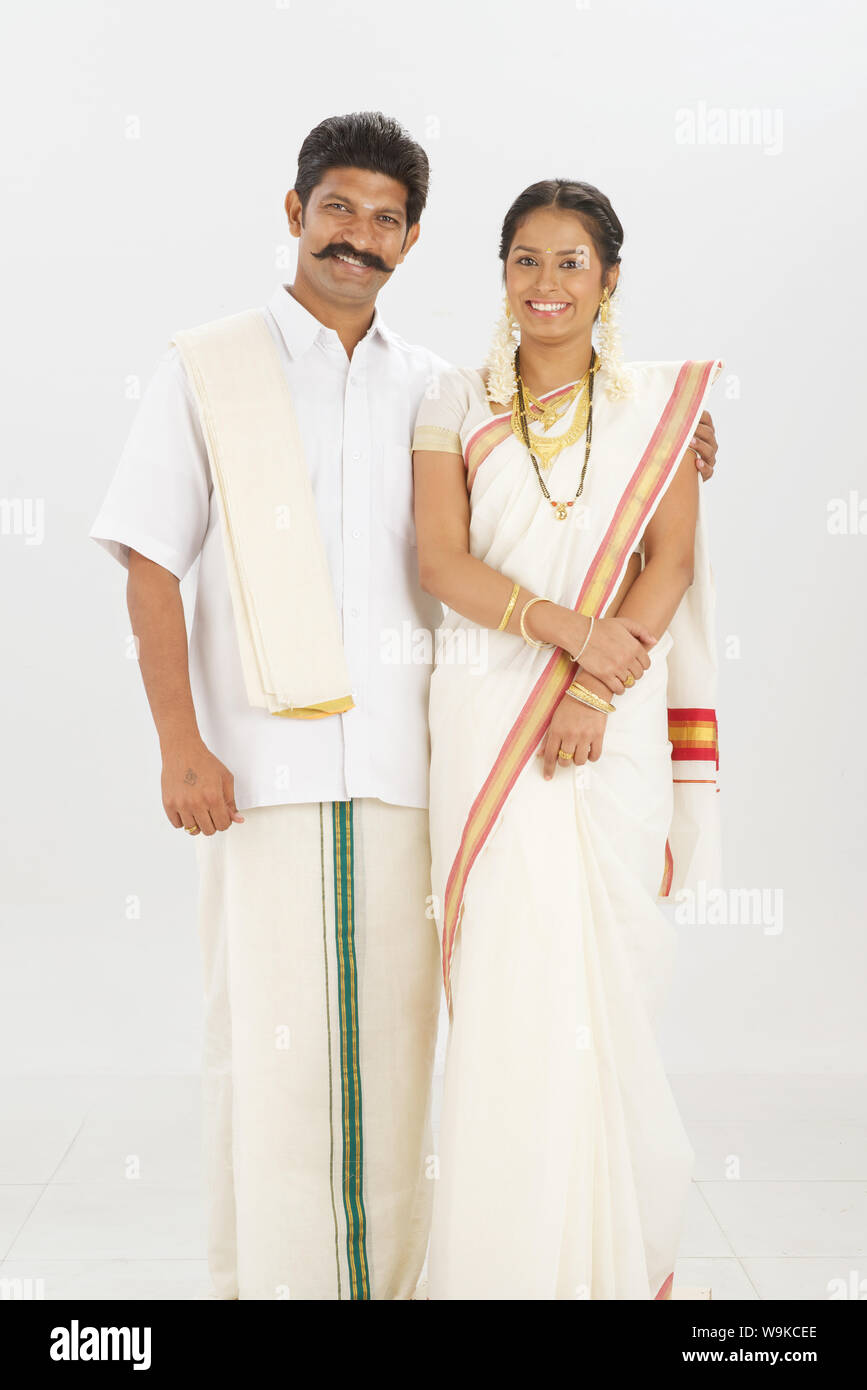 South Indian couple standing together and smiling Stock Photo - Alamy