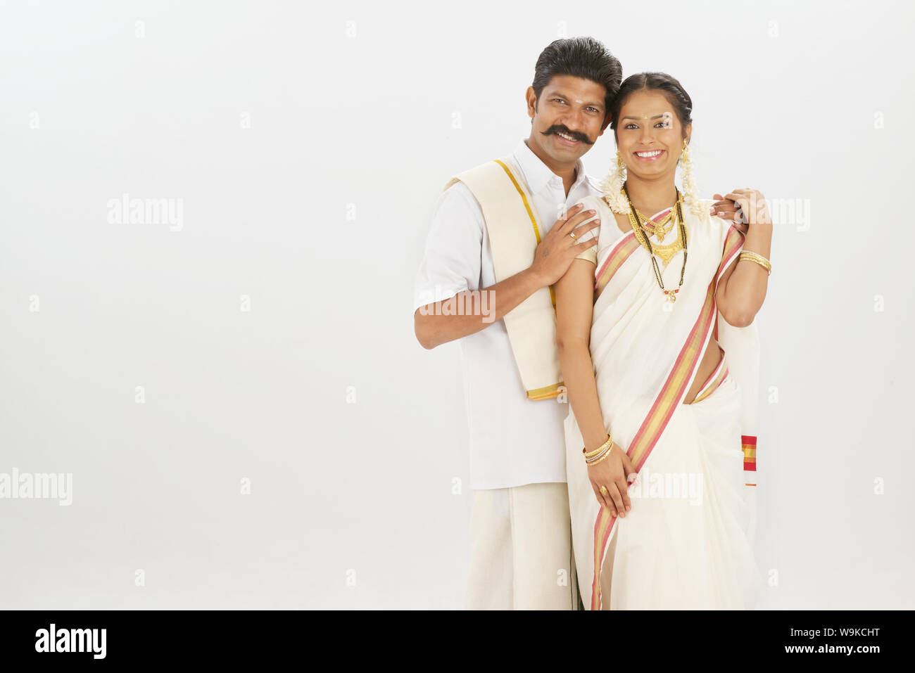 South Indian couple standing together and smiling Stock Photo - Alamy