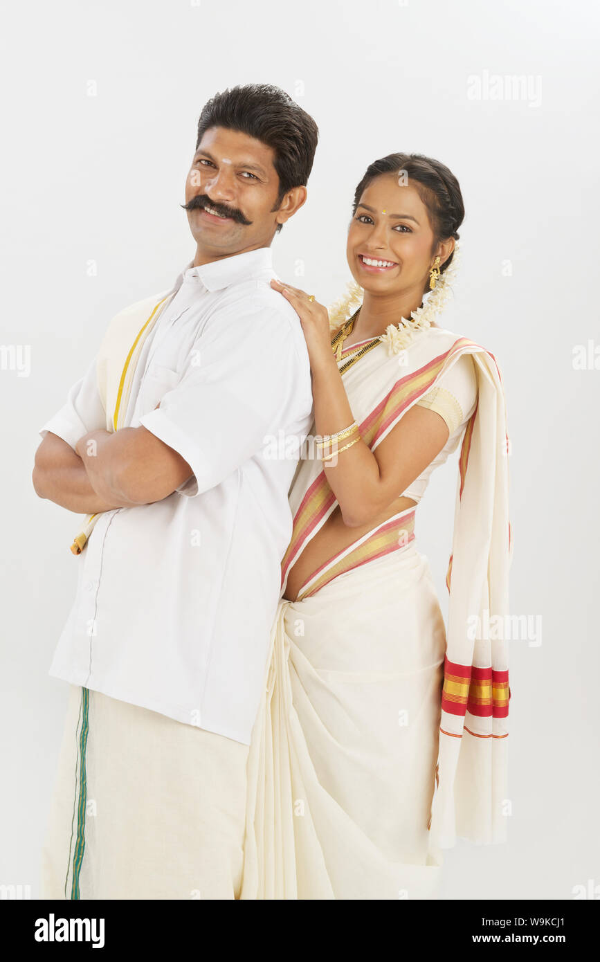 South Indian couple standing together and smiling Stock Photo - Alamy