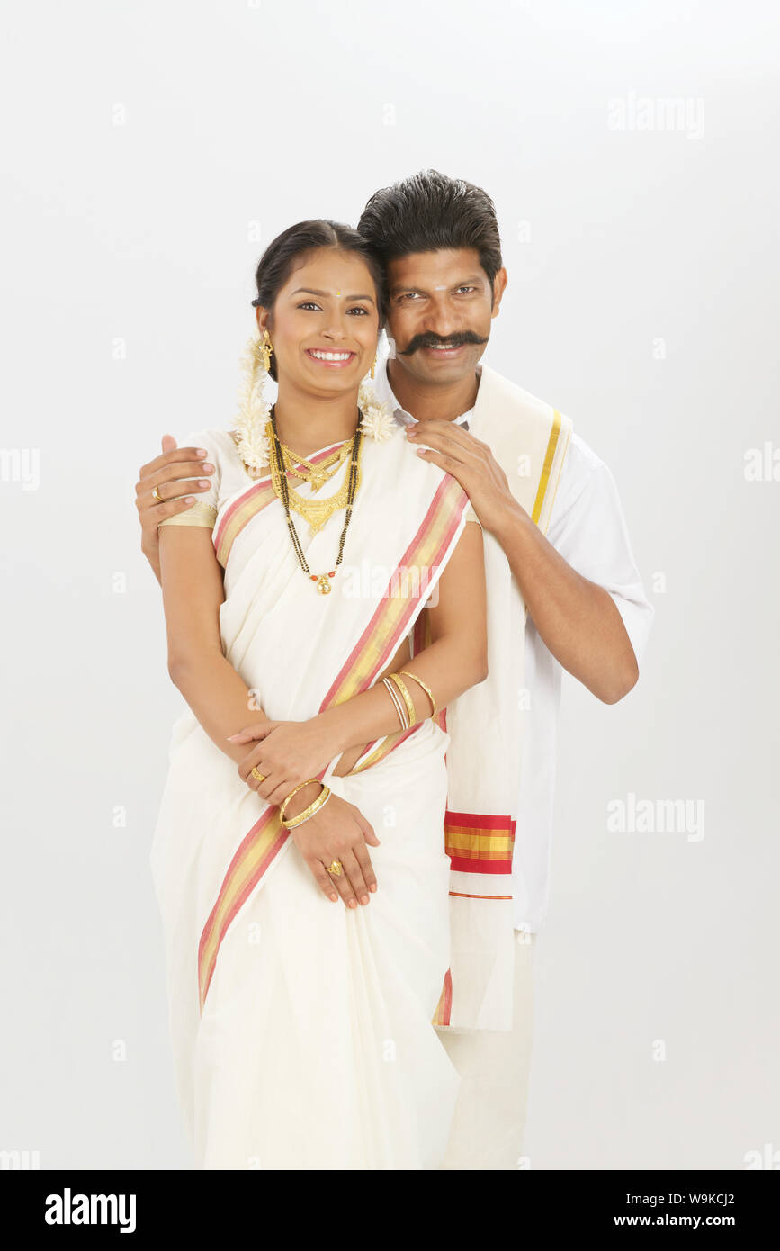 South Indian couple standing together and smiling Stock Photo - Alamy