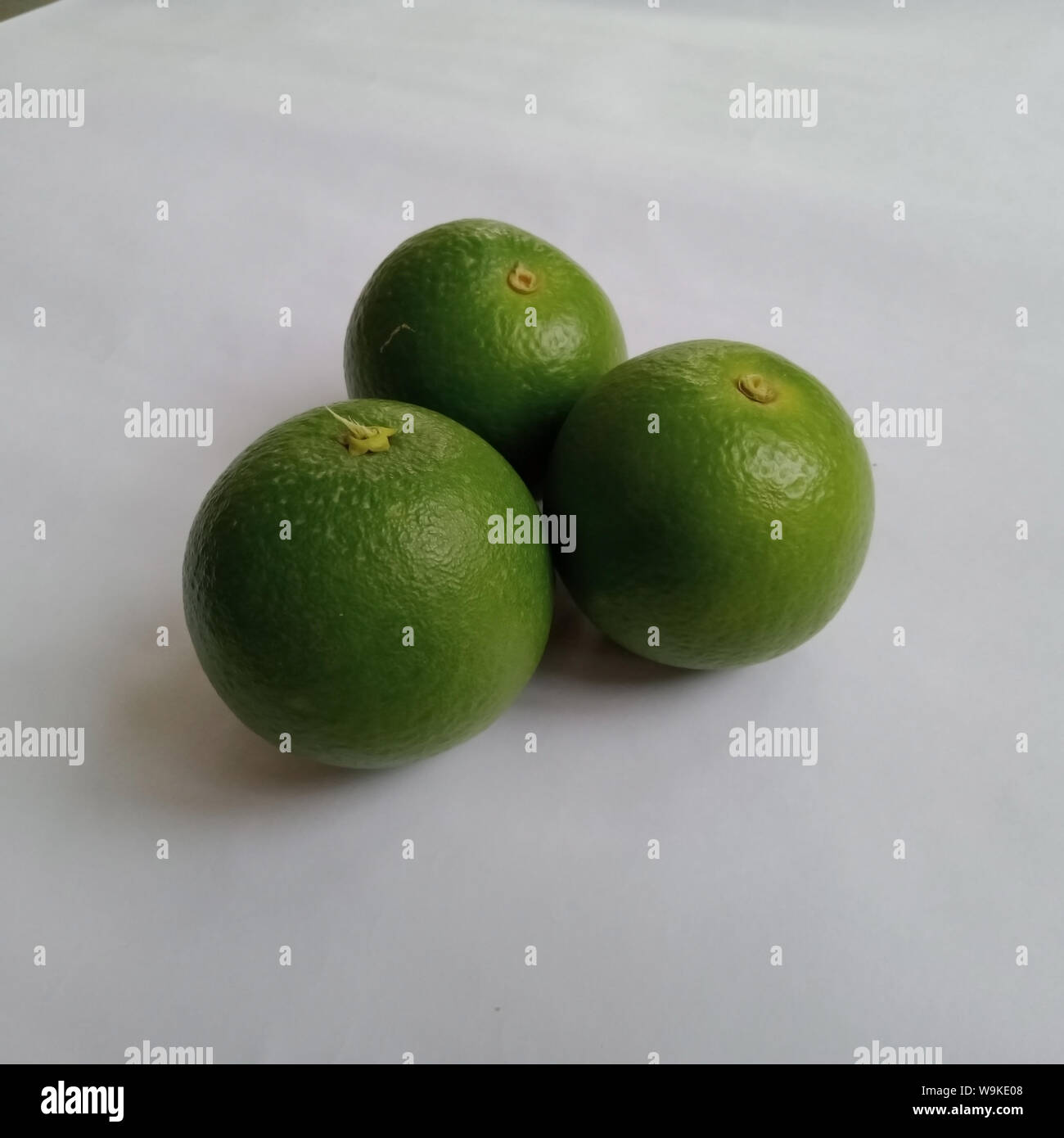 Three sweet lime (sweet limetta) fruits on a white background Stock Photo
