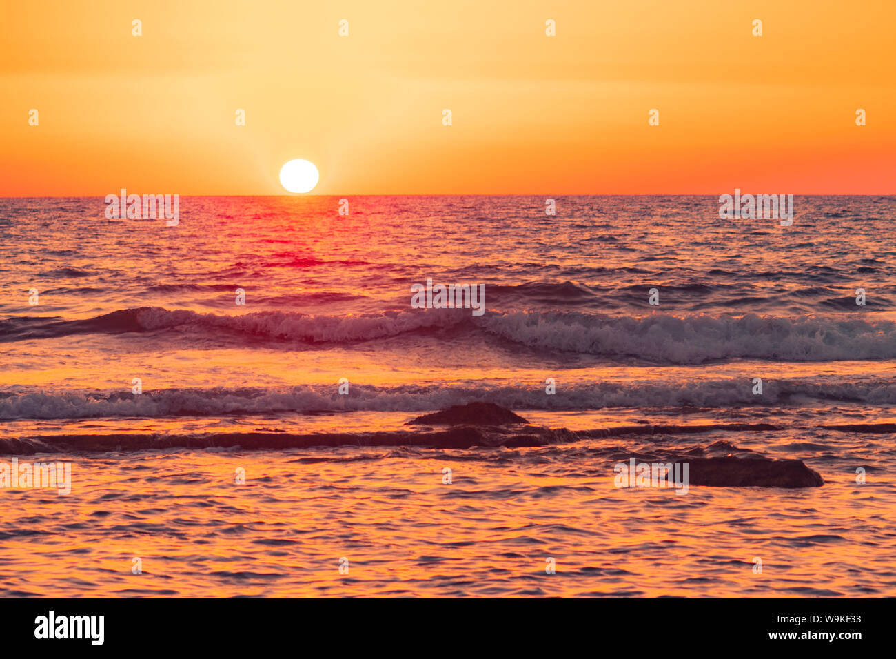 Red orange sunset over the sea horizon in the beach in Israel Stock Photo