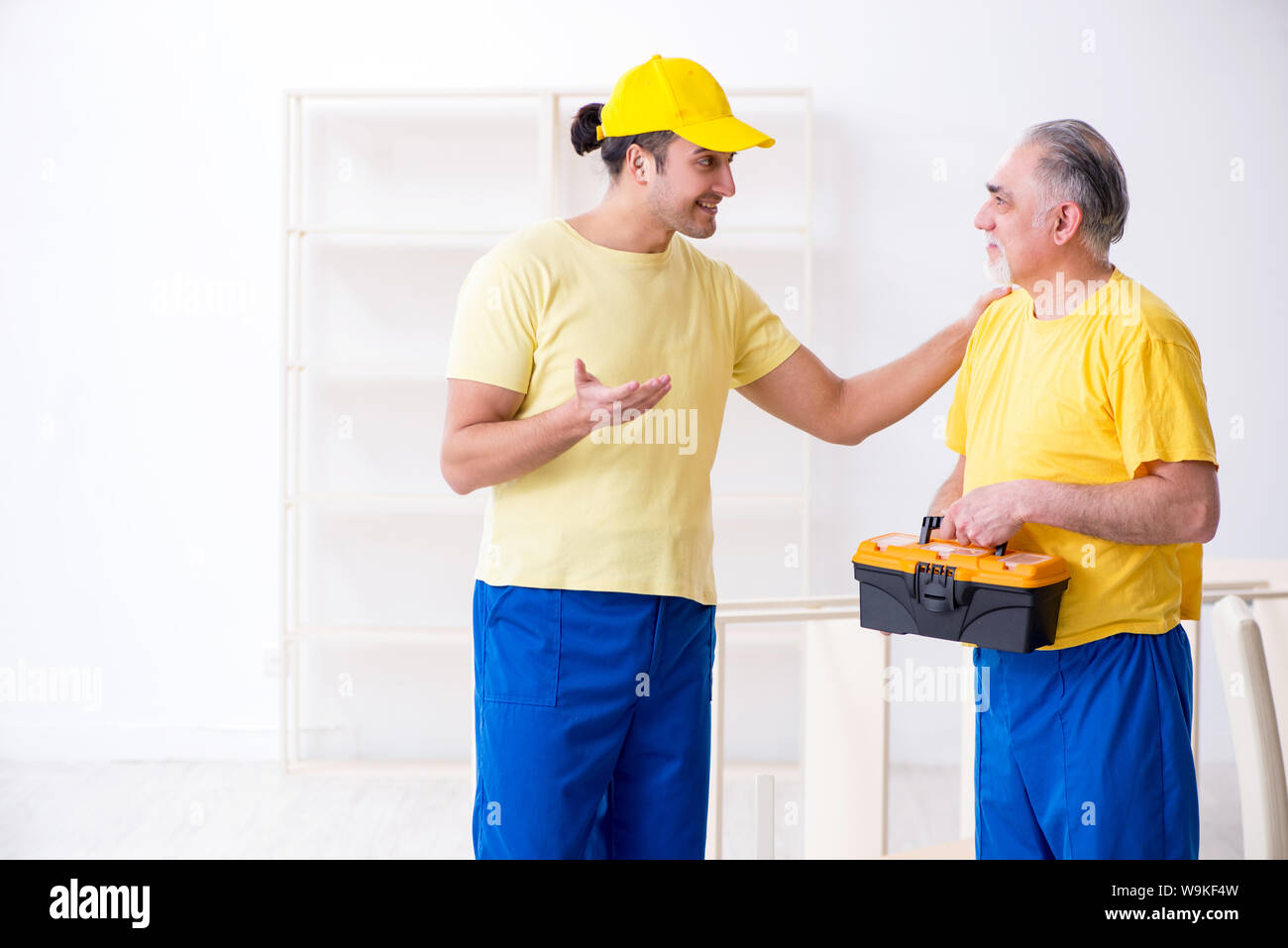 The two contractors carpenters working indoors Stock Photo Alamy