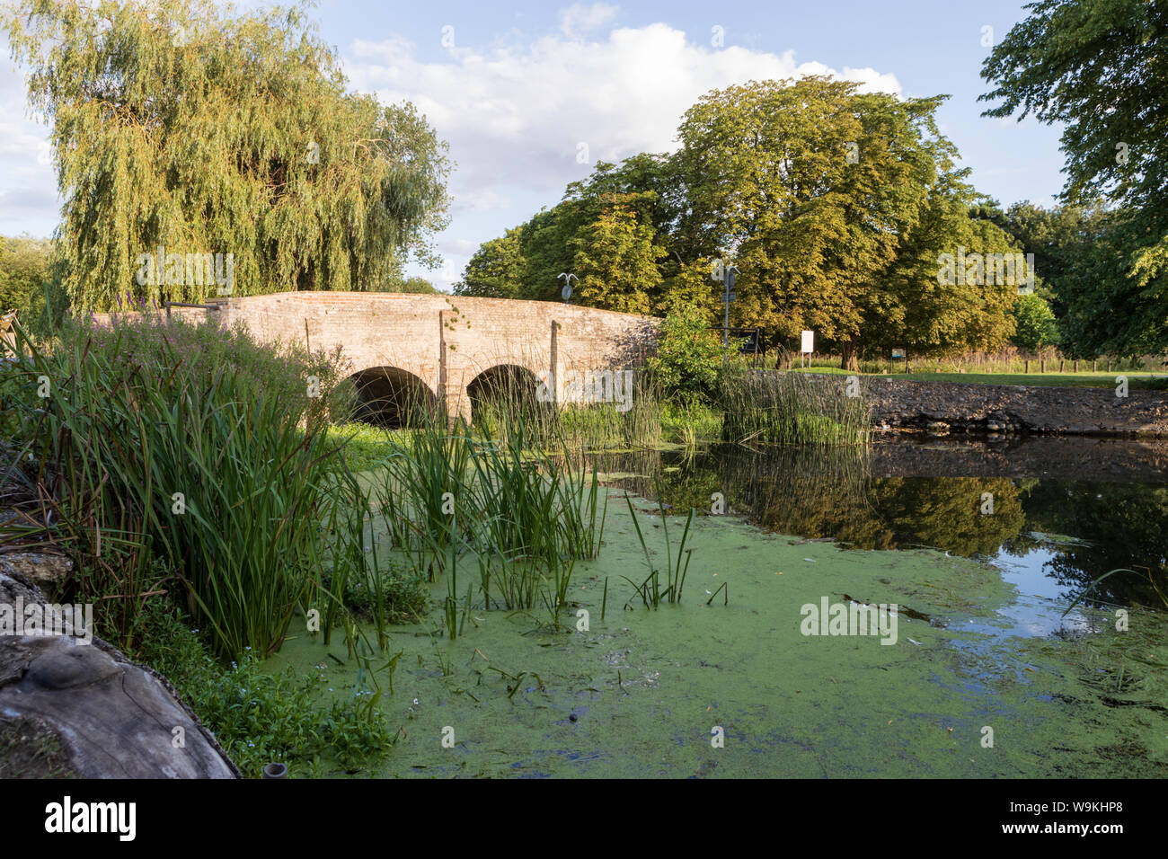 Twin arched bridge spanning the Little Ouse River at Nuns Bridges Road