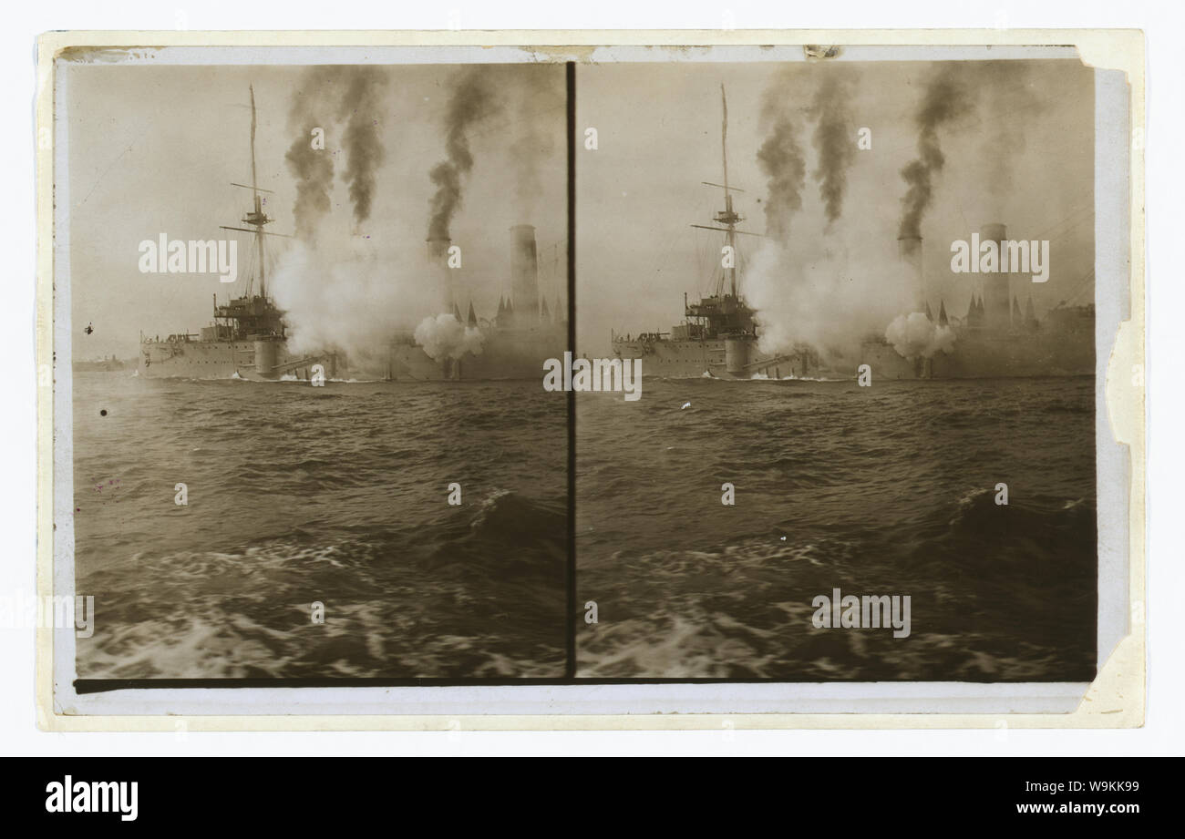 An American cruiser firing its guns in salute as it arrives in New York, probably at the time of the Portsmouth Peace Conference Stock Photo