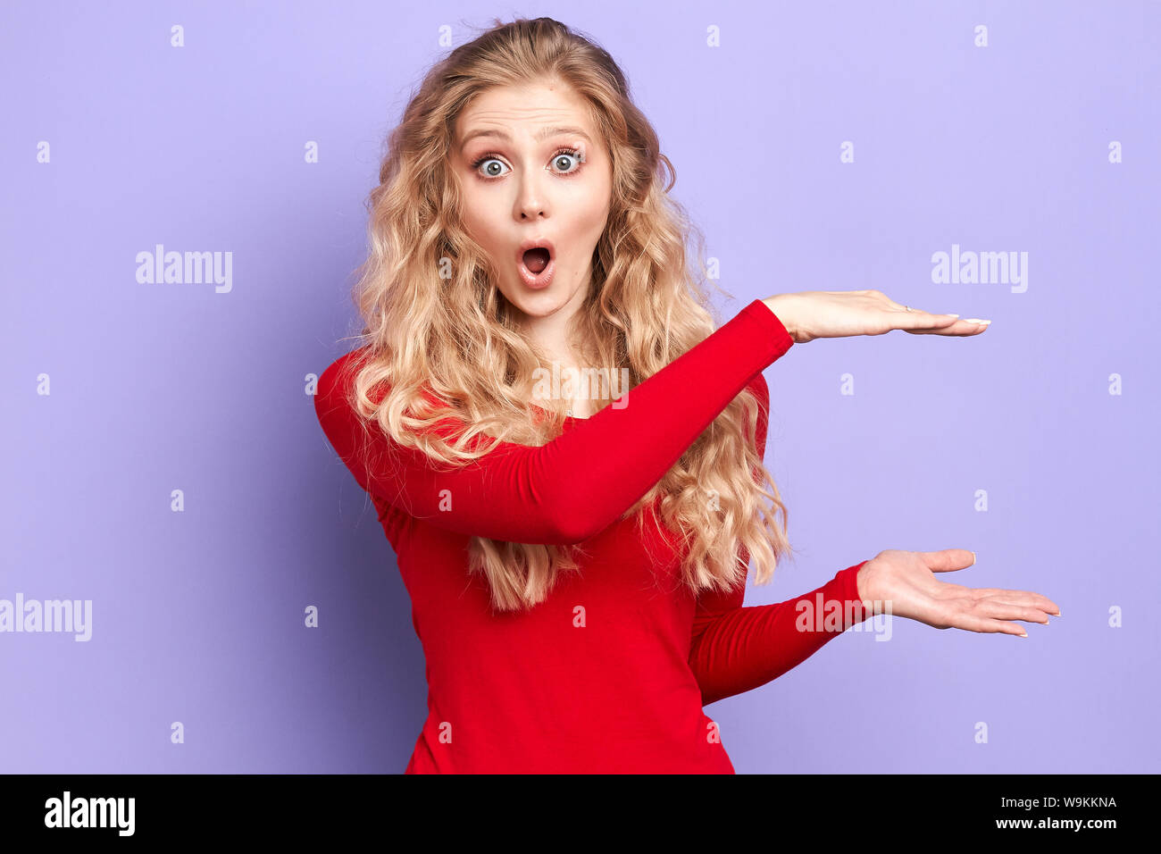 Excited Blonde Emotional Surprised Young Woman Shows Big Size