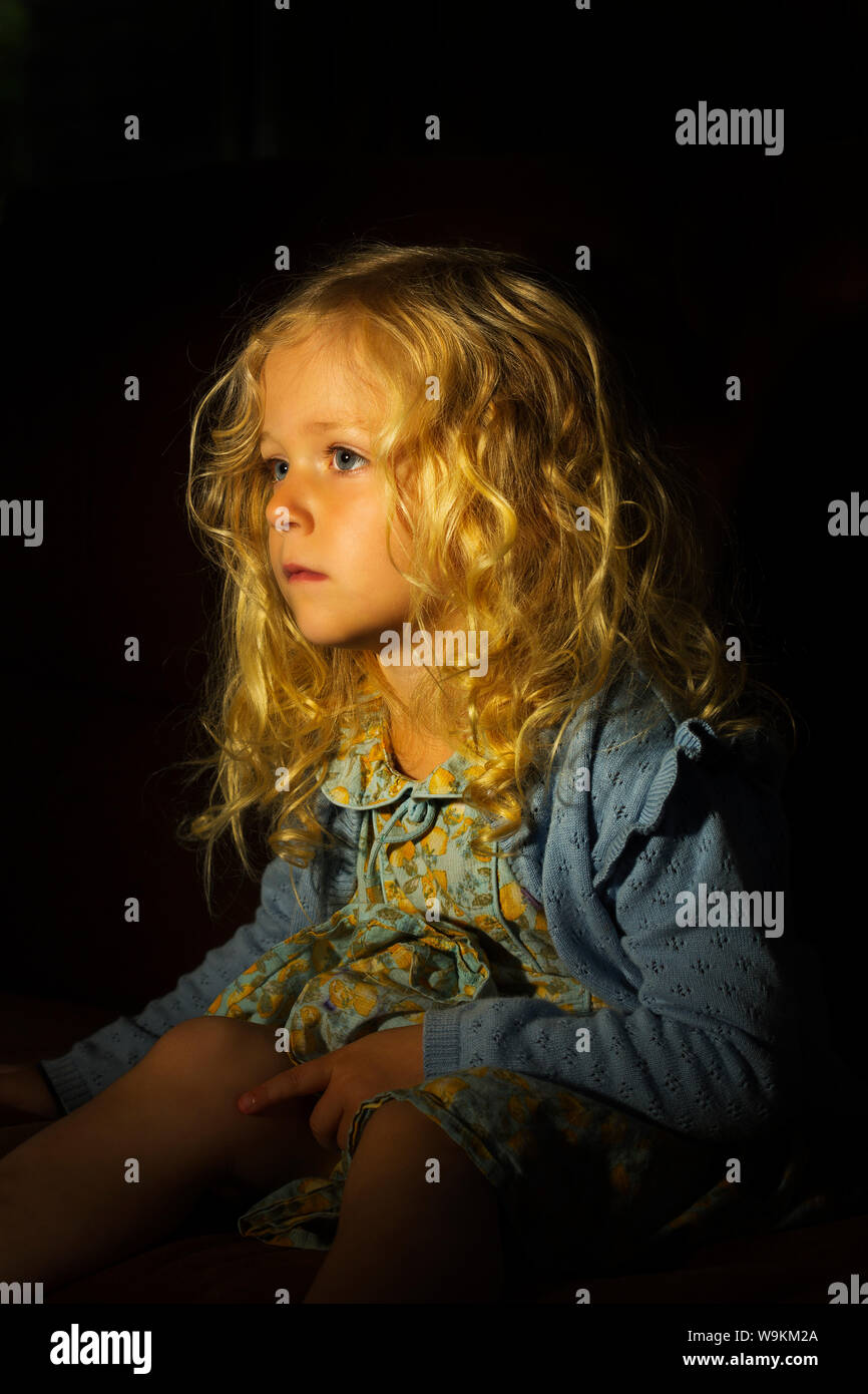 A beautiful little blonde haired with curls Stock Photo